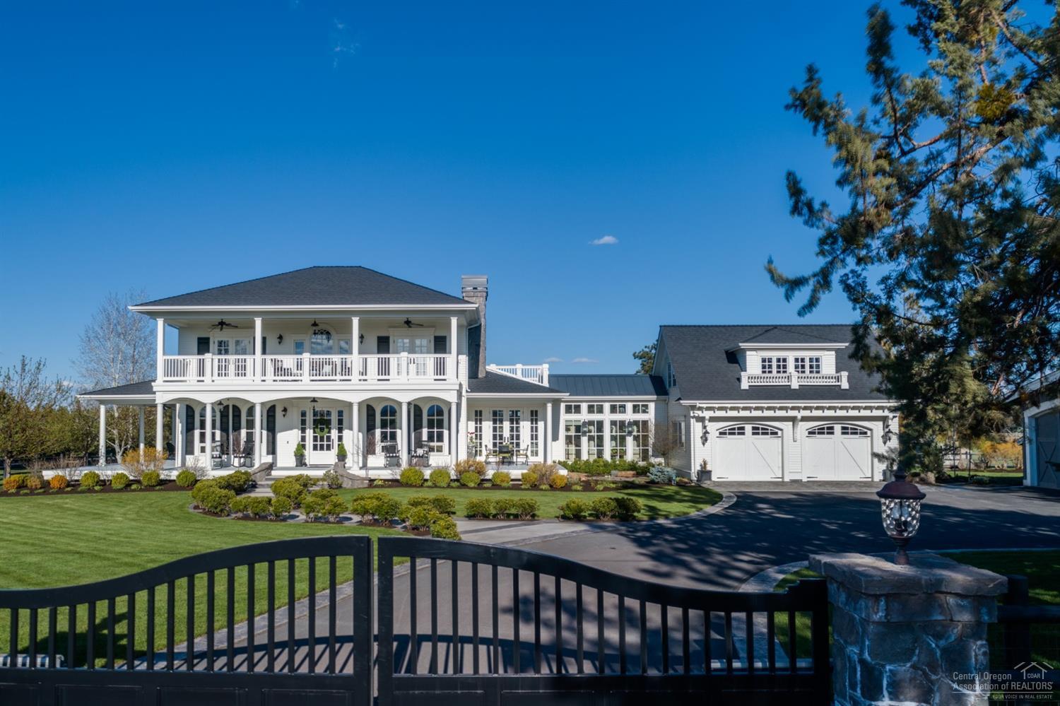 Every once in awhile, a special opportunity arises that tugs at our desires to follow our dreams. Let your search end here at High Mowing Lane. Just how does this Gentleman's Farm do it? She is a residence that is elegant, yet casual. Refined, yet relaxed. Stylish, yet unfussy. Wrap around porch, multiple private balconies and attention to detail that would make any other property envious, not to mention the unobstructed Cascade Mountain Views. A remarkable showpiece built to reflect and anticipate every desire and whim of its owners. Such a grand estate is not only a privilege to visit but also a rare opportunity to own. Oversized shop area affords extra parking for that car collector, the 3 stall barn is completely finished with a charming bunk house. Over 8 acres of irrigation offers you the experience of farm living close to down town Bend and Sisters. Gated entry. Ruth, Chris, Clarabelle and Rosie negotiable. Farm Deferral.