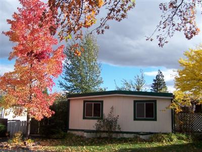 Cozy clean 3 bedroom, 1.5 bath doublewide in Ashland's Wingspread Park. New paint with lots of light, a fenced yard, carport with new roof, 2 sheds plus additional parking round out this older home in an all age park with duck pond. Shopping and restaurants nearby.