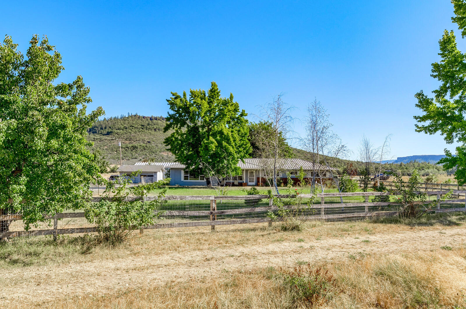205+/- acre farm. Approximately 145 productive, tillable acres with soils that could be classified as organic. Currently Hemp production. 105 acres of water rights include: 54.1 acres primary from Creek & 50.9 acres from the 12 acre Pond. There are two pivots, one full and one half circle, also New 2019 Drip irrigation. 3 New Floor dryers  in 2019 are also in the sale w/availability to run additional power w/generator(not included) for additional area. The 2077 square foot single level home has been tastefully updated and has 3 bedrooms and 2 1/2 baths and features vaulted ceilings. The hay barn is 80X120 with stalls and turnouts. The equipment building is approx. 80X28 and the secondary equipment shed is approx. 60X20. The property is served with 3-phase power. The reservoir covers 12+/- acres and Snyder Creek runs through the property. Plenty of wildlife visit the ranch including deer and elk and it borders BLM land and Upper Table Rock.