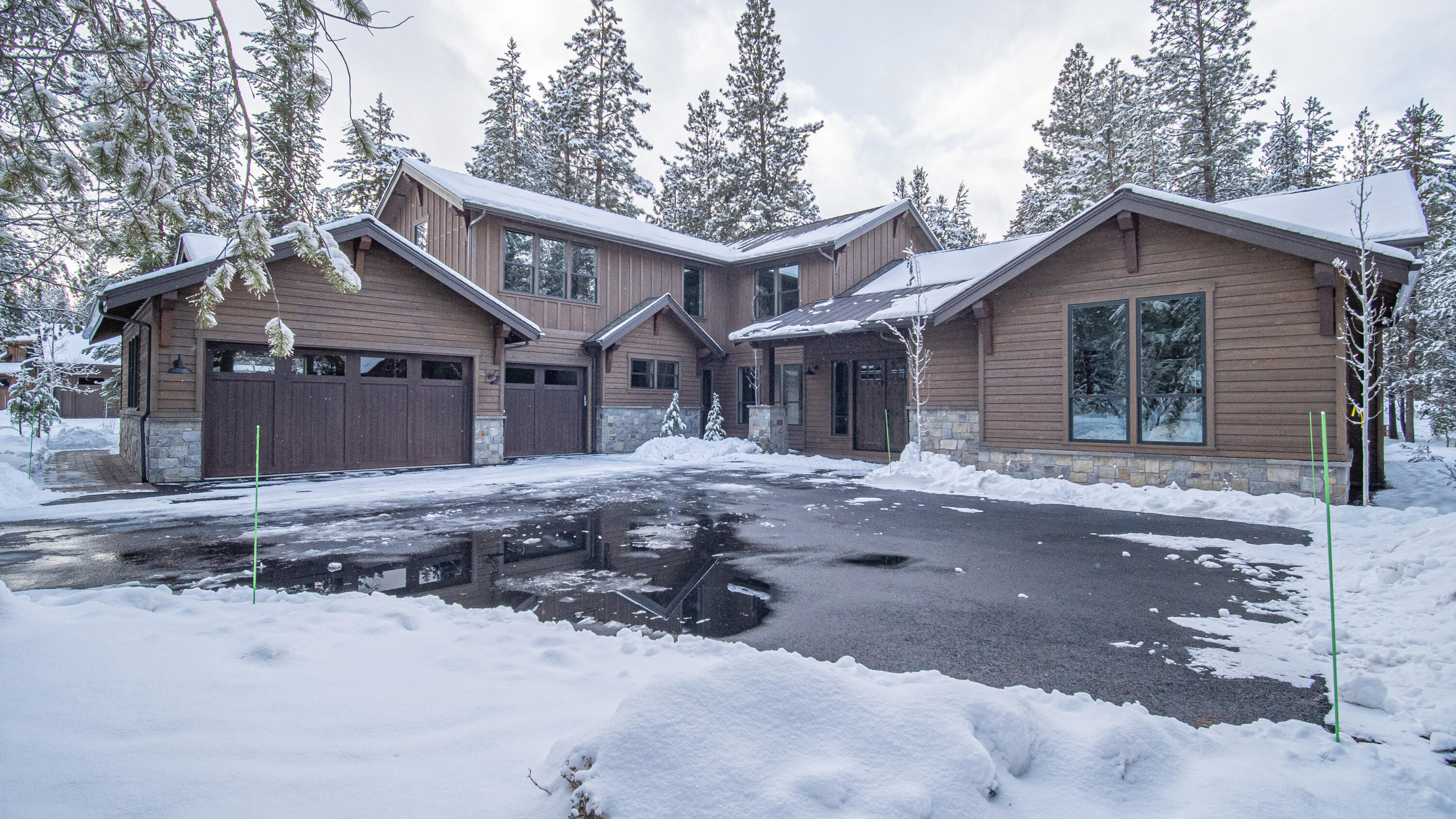 Nestled among majestic pine trees, enjoy the peacefulness of this beautiful home across from Sable Rock Park. This custom NW style home offers ample gathering spaces perfect for large groups, reunions, retreats, and special get-a-ways. There are three on-suites suites on the main level along with great room, gourmet kitchen, dining area, laundry/mudroom, powder bath and an expansive covered paver patio. Upstairs find two more suites plus recreation/bunk room. Features include distressed wood beams, custom cabinetry, rich woods, solid surfaces, designer tile, high-end appliances, and wi-fi enabled two zoned Central A/C. Contact your agent to preview today.