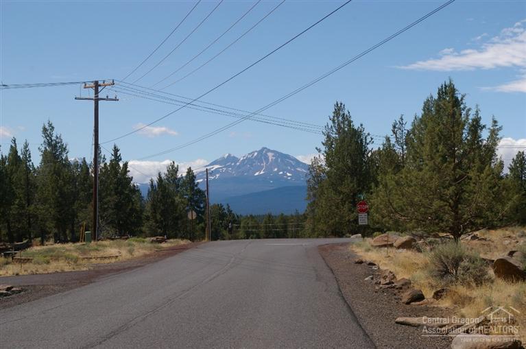 The lot has been cleared of underbrush. Lot is located on a paved road. Power line runs directly in front of the property. Flat build able lot with possibly mountain view if the home is positioned correctly on the lot. The lot is surrounded by custom homes and past Tour of Homes award winning homes.