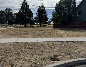 Beautiful flat city lot with utilities at the lot.  Property backs to the canal and Bend Parks and Rec has a proposed park for the property on the other side of the canal (which is directly behind the lot).  Lightly treed and with NO HOA.  Plans available for an additional fee.