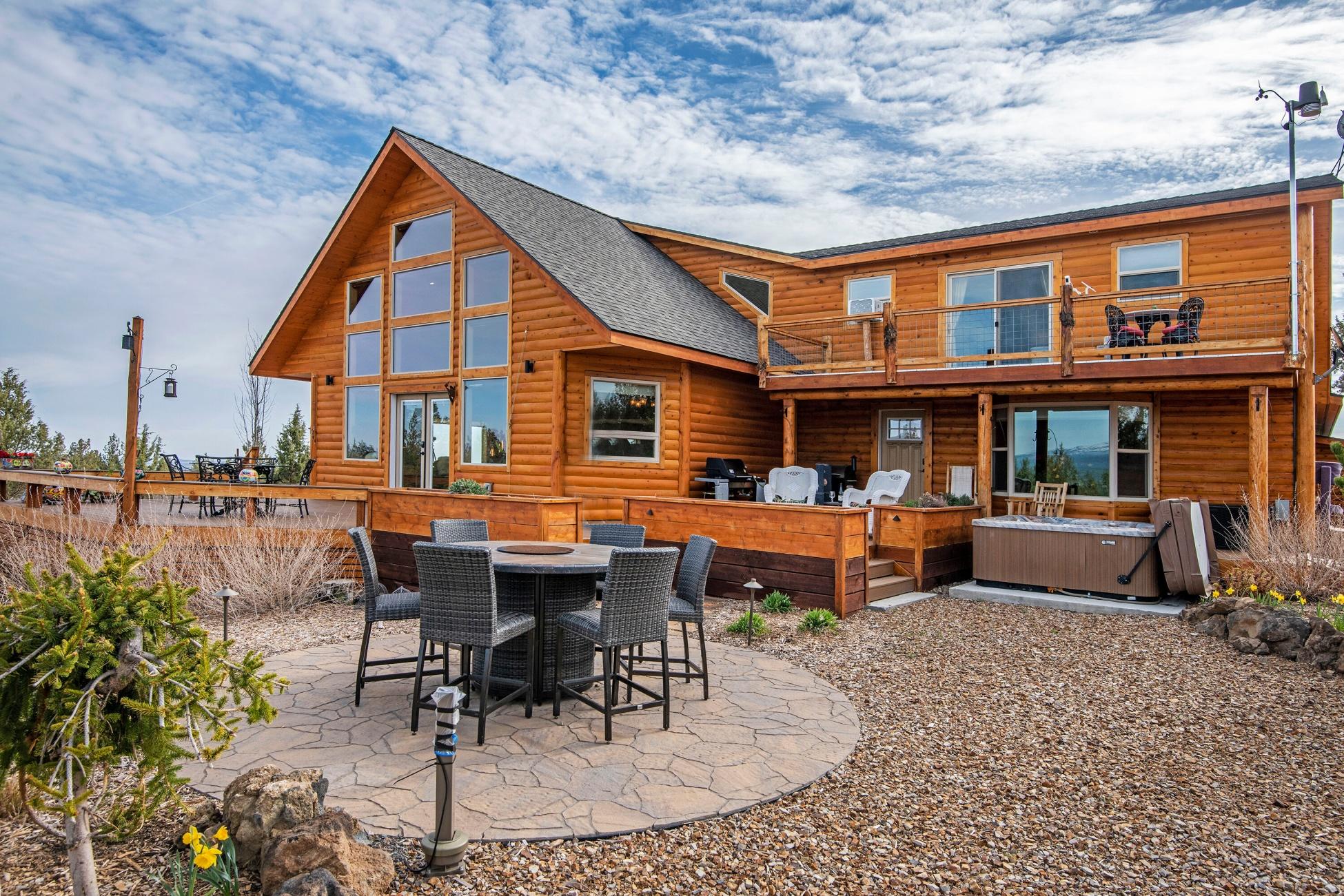 Jawdropping Cascade Mountain views of 9 peaks!  A modern home with huge windows and open floor plan on 13 plus acres.  Room to breathe and enjoy nature.  Located within the primary migration route for deer and elk, adjacent to public land, you can watch the wildlife throughout the year. You have everything you could possibly want in a 2016 custom-built home: a Great Room with a floor to ceiling stacked stone fireplace, beautiful vaulted ceiling and dining area just waiting to entertain all your friends and family.  State of the art radiant heated floors, a solar panel heats water & solar electricity can be sold back to the grid , Tesla back up batteries and an electric car charger. The well planned Gourmet Kitchen has a breakfast bar, top of the line appliances and an artistic SS backsplash.  Wake up to Cascade views from your bed and then step into the steam shower in an elegan elegant marble bathroom. Upstairs separate guest quarters await your company.