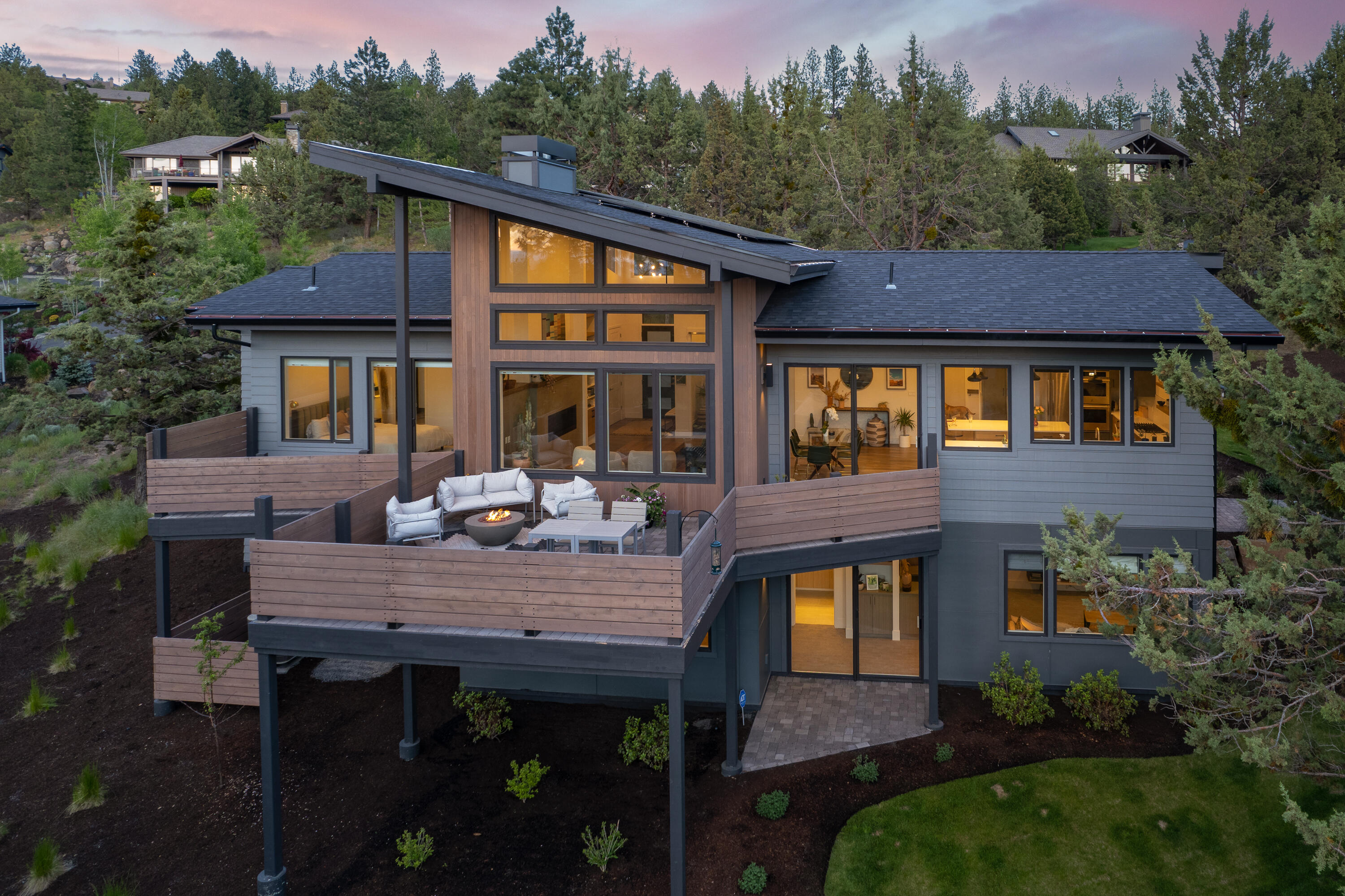 Wake up to gorgeous Cascade Mountain views from this lightly lived-in home built by Hackbarth Builders. This beautiful home features main level living with a spacious primary suite, an office, one guest bedroom and a full bath. The vaulted ceilings in the kitchen and great room combined with an abundance of windows create a comfortable space filled with natural light perfect for entertaining or watching the spectacular Central Oregon sunsets. 
Downstairs you will find a large bonus area with wet bar and mini-fridge, a private patio, a large guest room with a walk-in closet and a spacious bathroom with radiant floor heating. Outdoor enthusiasts will enjoy the close proximity to the river, hiking and biking trail systems, the Cascade Lakes and Mt. Bachelor. The oversized garage two RV-sized doors, new epoxy flooring and plenty of room for all of your toys! This home comes with 16 solar panels that power the entire house plus one electric vehicle!