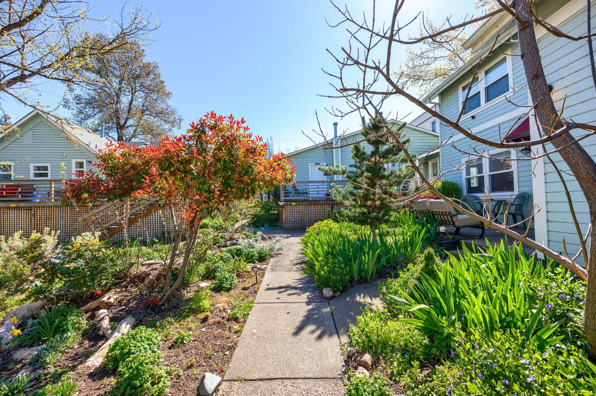 Excellent opportunity. Currently named The Carlisle Garden Suites has 9 units set within three different buildings on two tax lots with an amazing central location just blocks from beautiful downtown Ashland, Oregon. Lot of potential with a versatile C-1 Zoning allowing for many different uses. Currently has month to month Tenants in a number of the units. Property has been in the past, and can still be used for traveler's accommodation. Buyers to do their own due diligence with the City in regard to their potential desired use.