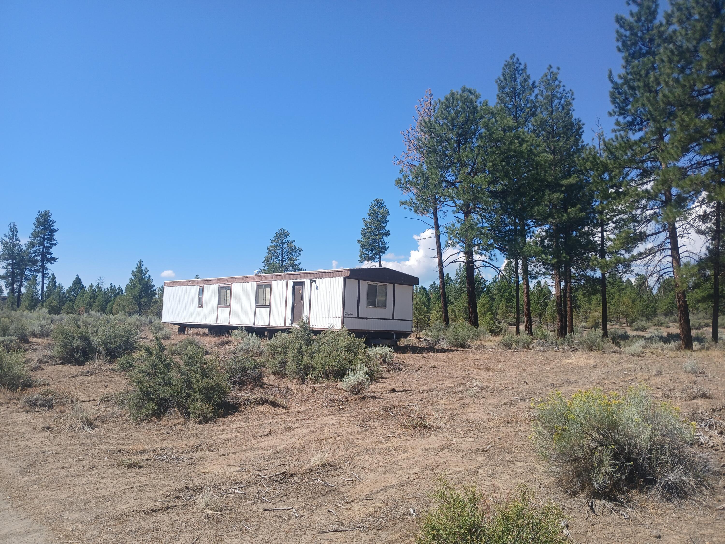 VERY MOTIVATED SELLER! Owner is willing to finance at $25K sale price w/$8K down & no interest for up to 5 years. Here's 2+ acres in an off-grid area located near thousands of acres of public lands w/unlimited recreational opportunities. The area is known for premium hunting. Close to the town of Sprague River providing basic essentials w/2 stores, post office, & rural fire department. The nearby Sprague River offers boating, great fishing, & water recreation.  Zoned residential w/legal access it is ready to develop. Included in the sale of the property is a 784 sq. ft. 1978 Gibraltar manufactured home that is in excellent condition. Because the manufactured home still has it's tongue & axels w/wheels, it can be easily moved to a different property. Property has septic approval for standard leach field system. Manufactured home can be purchased for $5,000.