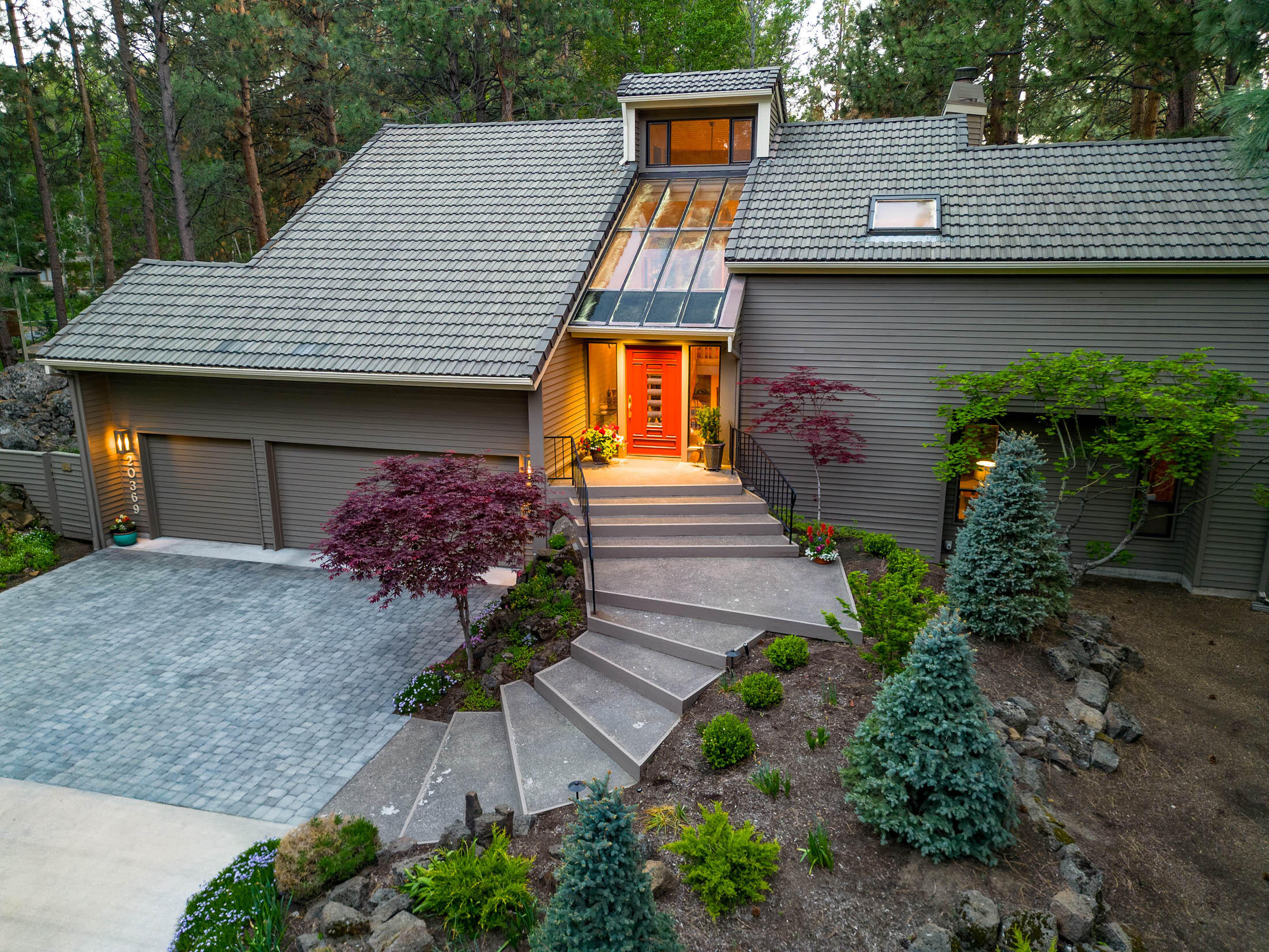 Luxury Living at Its Finest in the Mtn High Gated Comm. Discover the epitome of elegance in this custom-built hm by SunForest Construction. Situated on a premier .76-acre lot, this property offers unparalleled privacy & a picturesque setting. The reversed-living floor plan allows you to immerse yourself in nature, providing the feeling of residing in a luxurious tree house. The grand great rm welcomes you w/ soaring cedar wood ceilings & a cozy gas-stone fireplace, creating a warm & inviting atmosphere. Gleaming engineered  hardwood floors flow seamlessly through the formal dining rm, gourmet kitchen w/ an island & charming breakfast area, making it an entertainer's dream. Immerse yourself in the artfully designed architectural masterpiece that seamlessly blends indoor & outdoor living spaces. Indulge in breathtaking views of the private landscaped yard, majestic Ponderosa trees & serene walking paths & adjacent golf course. Don't miss the opportunity to make this stunning hm your own.