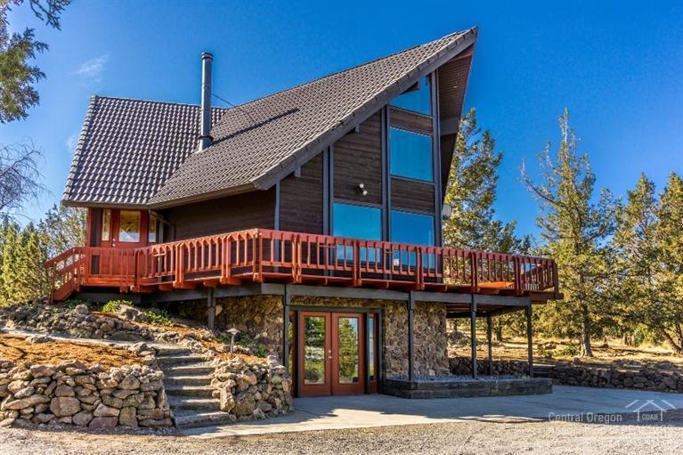 Chalet style home with incredible views of the Cascades and Smith Rocks. You will enjoy the room in this 2,346 SF home. Large rooms with lots of space for entertaining. Remodel has been completed and includes new cabinets throughout, new carpet, vinyl and wood floors, light fixtures, appliances, front door, new deck and exterior paint; this home just shines. 5 acre view parcel for the elbow room and located only miles from Redmond and Bend.