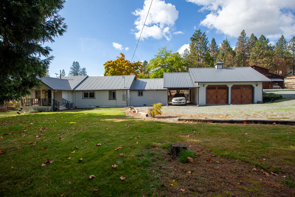 Beautifully updated 3 bed, 2 bath home on nearly 5 level, usable acres in Grants Pass. Fenced and cross-fenced and has a large barn with 4 stalls and two paddocks bring your Horses, Livestock, 4-H Projects or Animals  Recently remodeled with modern touches throughout, this home is move-in ready and offers a peaceful country setting with tons of potential. The barn and acreage provide a great setup for equestrian use or hobby farming. Large fenced garden area, RV parking, and future outbuildings. Enjoy privacy and open space just minutes from I-5, shopping, and downtown Grants Pass. Local favorites like the Rogue River, Riverside Park, and the Growers Market are all close by. This is the ideal blend of rural lifestyle and in-town convenience. Whether you're looking to start a mini-farm, bring your horses, or simply enjoy a bit more elbow room, this property delivers. Don't miss your chance to own a slice of Southern Oregon paradise!