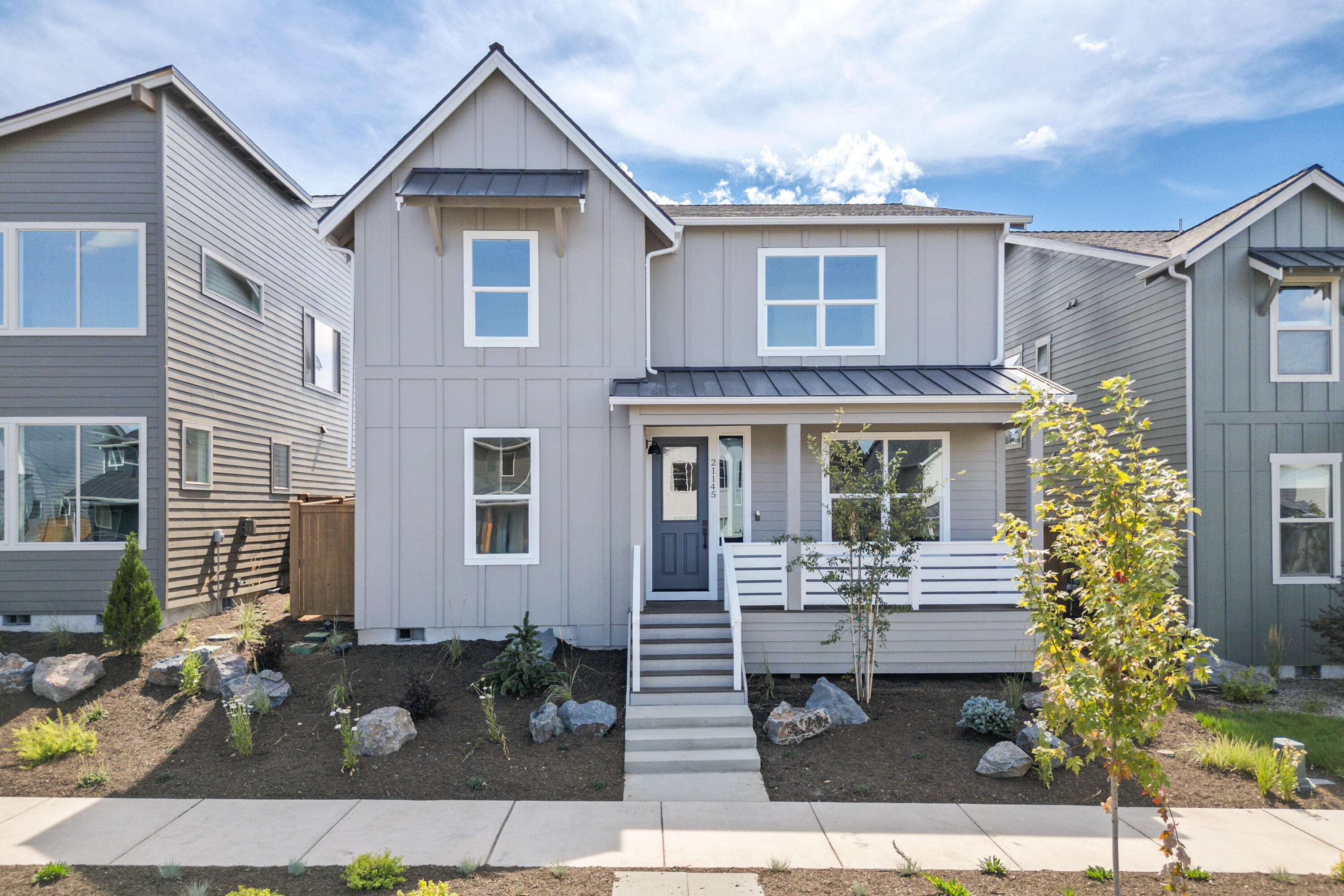 This modern farmhouse-style home in NE Bend's convenient Sky Vista neighborhood, offers an open-concept main level with a spacious kitchen, large island, corner pantry, and seamless flow into the living and dining areas - perfect for entertaining. A main-level den provides a flexible space for an office or guest room. Upstairs, enjoy a luxurious primary suite with dual vanities, tile shower, and walk-in closet, plus three additional bedrooms, a full bath with double sinks, convenient and thoughtfully designed laundry room. Every detail has been carefully considered, offering a perfect blend of function and style.