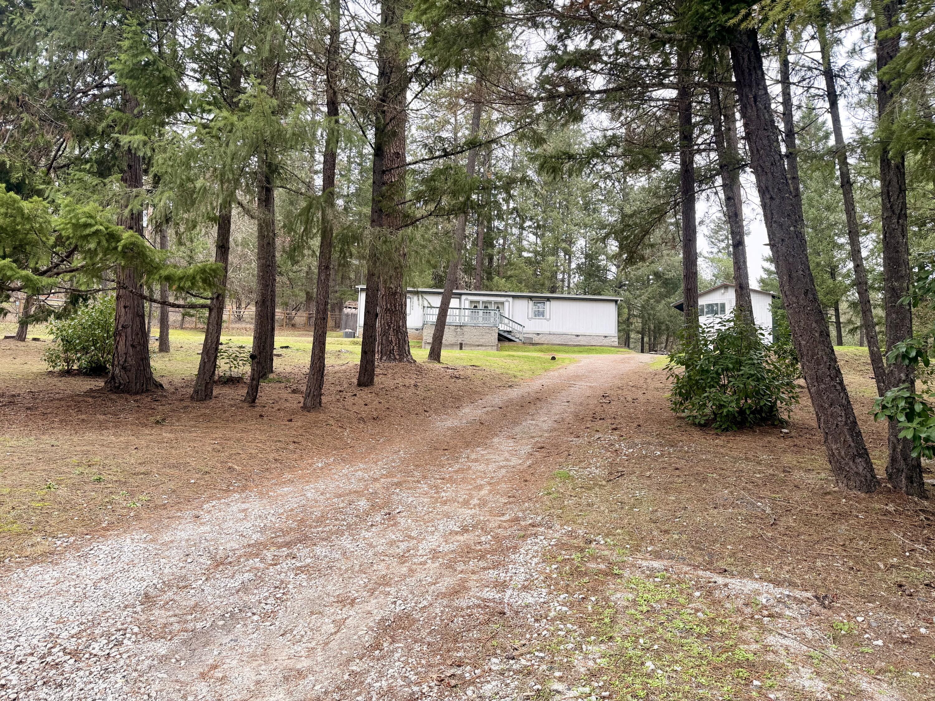 Manufactured home on 1.05 park-like acres in a quiet end-of-road setting, offering privacy while remaining close to town amenities. The property features a large shop with ample space for storage, hobbies, or projects, along with usable land that provides plenty of room to enjoy the outdoors, garden etc.
The home is in good condition and would benefit from cosmetic updates such as fresh paint and new carpet, allowing the next owner to add value and make it their own with a little TLC and fixing up. The septic drain field will require repairs, which have been considered in the pricing and an estimate is included in the docs section. New Well pump 2024!
Great opportunity for a buyer seeking space, a peaceful location, and future potential!