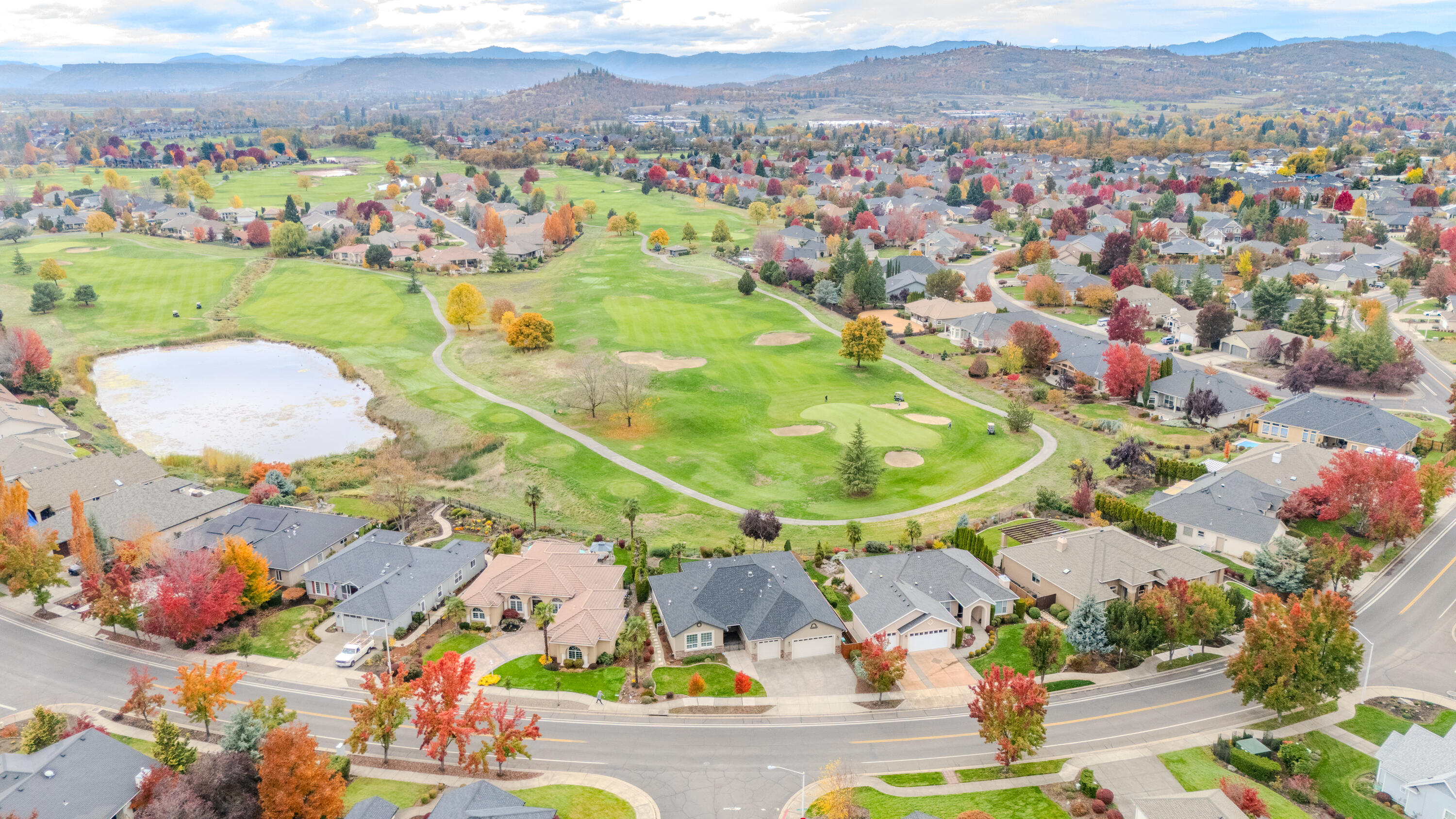 Luxury Living on the Eagle Point Golf Course! Enjoy Year-Round Outdoor Living on your stunning covered back patio featuring dual ceiling-mounted gas heaters, two electric sun shades, outdoor TV, relaxing rock waterfall, and panoramic views of the 5th & 6th holes with the Table Rocks in the background. Extensive 2023 remodel includes New Roof w/Restructure to Cover Patio, New AC Unit, New Exterior Paint, New Hot Water Heater & in 2024 New Dishwasher. This immaculate 4-bedroom plus office/bonus room home features a spacious gourmet kitchen with granite countertops, JennAir gas cooktop in island, double ovens, ample cabinetry, and picturesque golf course views. Elegant tile flooring throughout, cozy gas fireplace w/mantle in family room, gas stove in office, and 3-car garage with attic storage. Meticulously maintained and move-in ready! Experience luxury, comfort, and the best of Southern Oregon living—golf, wineries, lakes, rivers, hiking, Crater Lake, and year-round recreation nearby