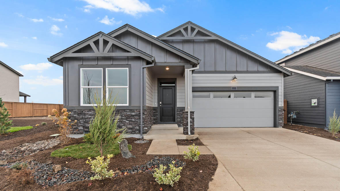 The Spruce is a functional 1,435 sq. ft., one-level 3 bed 2 bath floor plan with Smart Home Technology included! The two front bedrooms are centrally located between a full bathroom. The stylish kitchen has stainless-steel appliances, quartz countertops, full height backsplash, pantry, central island, and a gas range/oven. The dining area flows into a light and bright great room with a cozy fireplace, ideal for entertaining. Primary bedroom includes a walk-in closet, en suite with double vanity, and extra storage. 

Visit Stevens Ranch in Bend, located near Reed Market Rd in a serene residential area with access to outdoor living and adventure, the city, and historic downtown Bend. Sales office hours are 9:30am - 4:30pm daily. Photos are representative of plan, features/specs may vary!