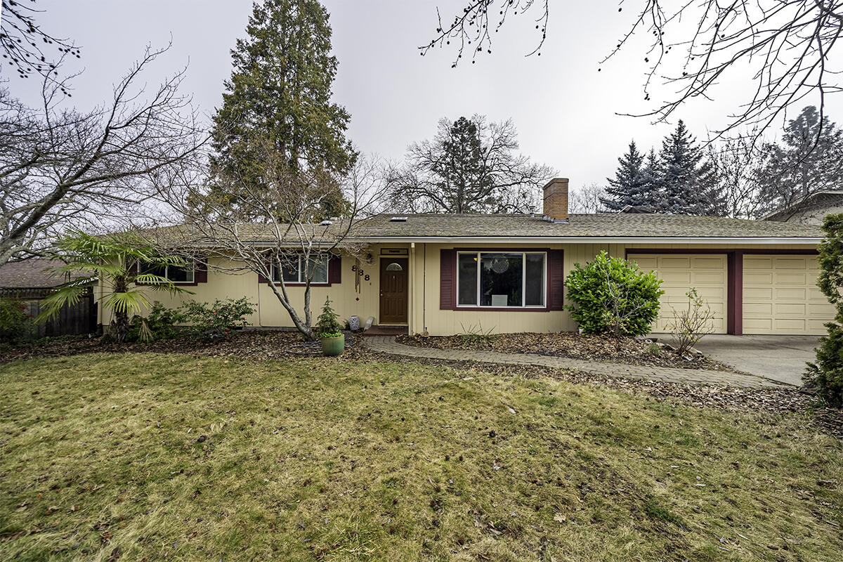 Solid single-level 2230 sf ranch style home on large lot in sought after Ashland location. Private & wonderful outdoor living area with many mature trees for shade, landscaping in front & rear, entertaining deck, & loads of room for your sunny organic garden, & a natural rock water waterfall that creates a harmonious feel to this property. The interior has multiple spacious sunlit main living areas.  Living room, hardwood floors & fireplace at entrance & a large cheerful sunroom that runs length of the
home at the rear both offer great gathering spaces. Very large kitchen with lots of counter space, tiled flooring & lovely adjacent dining room. Generous-sized primary bedroom suite with nice, tiled bath and private access to rear yard. 2 additional bedrooms & 2nd full bath. The well-lit laundry room has ample
cabinets & storage. This home has good amounts of sunshine throughout from the immense picture window in front to the sunroom in the rear. 2 car attached garage. Great property!