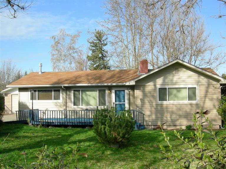 This is a very clean 2 bedroom, 1 bath, 1135 sf home on a spacious .41 acre city lot. The home features beautiful hardwood floors, new carpets, new double pane vinyl windows, a brick fireplace, new gas stove in the LR, new interior paint, refinished kitchen cabinets. All appliances in the main house stay. The house has a handicap ramp & tub. There is also a second dwelling unit that features, 1 bedroom, 1 bath, 616 sf, large living room and kitchen. This could be a legal rental. Buyer to do due diligence with city planning on the rental. As per inspection report there are some under structure issues, seller will not due any repairs, house is sold AS-IS. Call agent for details.