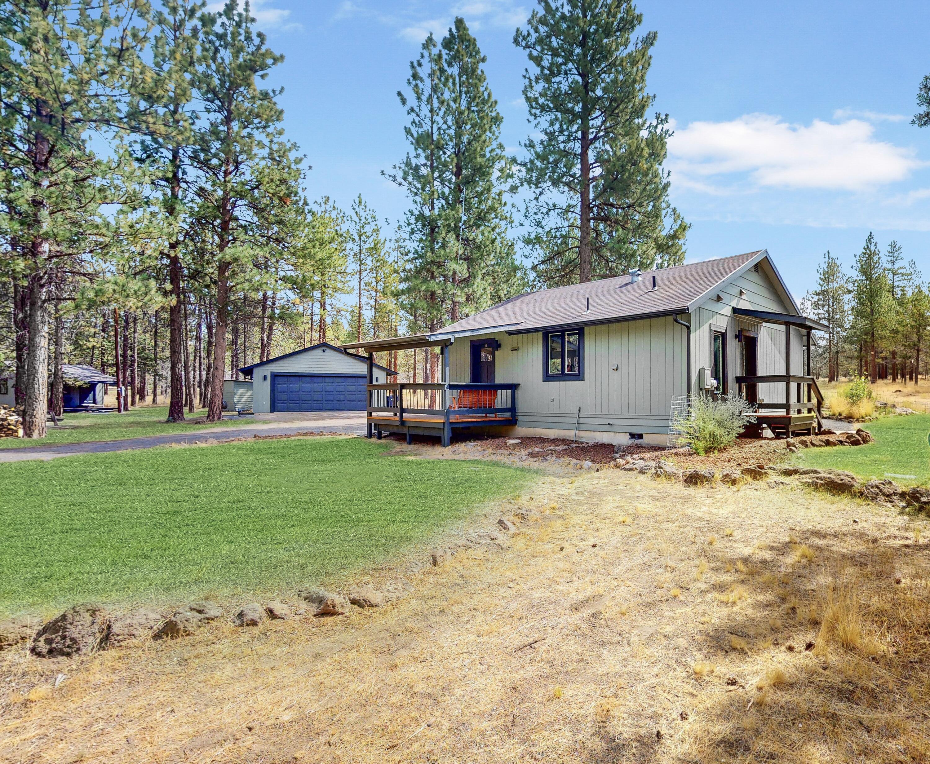Welcome to a serene retreat nestled on almost 5 acres of meticulously maintained land. This home has been completely updated boasting newly painted exteriors, new doors & windows. Inside, the remodeled kitchen features quartz countertops, penny tile backsplash, soft-close cabinets, new appliances, an undermount sink & floating shelves. The luxurious freshly remodeled bathroom offers a walk-in shower, floating vanity & rain shower fixtures. Enjoy the warmth of the woodstove in the open living space with new luxury vinyl flooring and modern lighting. Outside, the thoughtfully designed landscaping includes native plants, in ground sprinklers, and newly planted quaking aspens. The property also features new stained decks, a detached guest studio/office, & trail access. Additional highlights include a cozy high efficiency woodstove, a spacious two-car garage, RV parking/pad and plenty of room for expansion. Don't miss your chance to own this unique and inviting property!