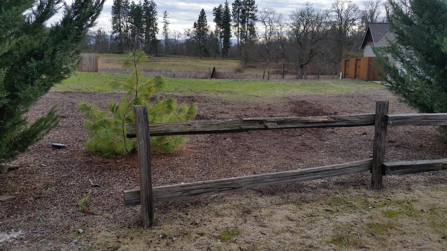 Large level lot in the desirable Echoes of the Ponderosa Subdivision, which is right across the road from the Eagle Point Golf Course!! This lot is located directly across from the park, on the corner and backs up to large EFU acreage with nice view and lots of privacy. Come build your dream home here.