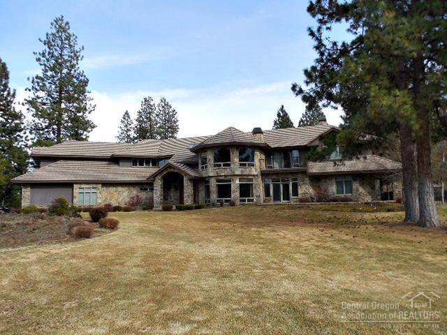 Incredible home in the desirable gated golf community of Sunset View Estates. This home features travertine flooring, granite slab counters, beautiful stone work, extensive custom wood work, theater room with whole house audio, game room, spa/sauna, elevator, and 4-car garage. The property borders Lost Tracks Golf Course, with its own private lake. One-year home warranty provided by the seller.