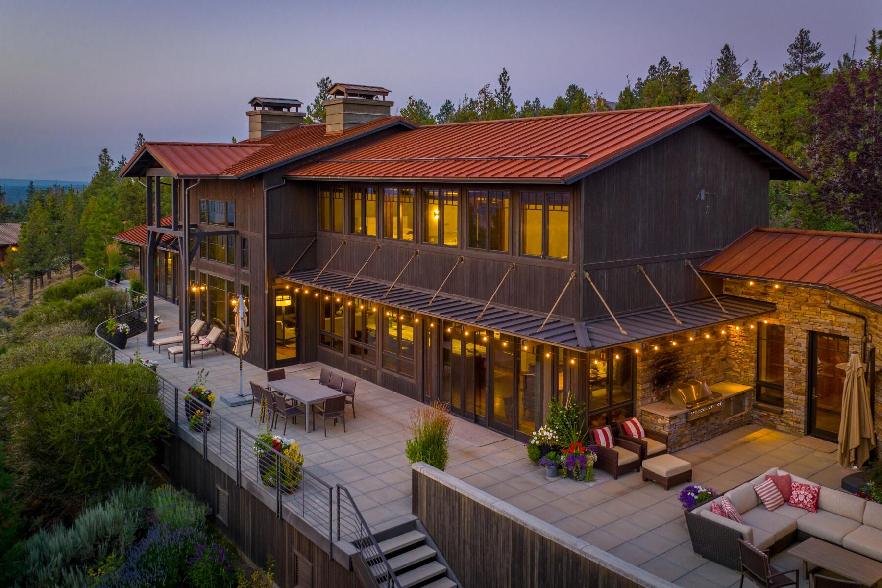 Located on a premium lot in North Rim with panoramic views of the Cascades,
this architecturally significant NW Contemporary is a stand alone
masterpiece with a timeless design that 
embraces the external beauty of the surroundings while offering breathtaking
views from nearly every room. Soaring ceilings, expansive windows, rich hardwood beams and extensive stonework create a
warm, sophisticated atmosphere that inspires a harmonious connection with nature.
Enjoy upscale gatherings in the awe-inspiring kitchen that opens to an
expansive deck, drenched in scenic landscape, with impressive outdoor
fireplace and seating area. Celebrate in the formal dining room accented with elegant cabinetry and serviced by a Butler's pantry.  Relax in the gorgeous Primary Suite
with Luxury Bath and grand
closet. Three additional bedrooms w/ensuite baths, two private studies, a
Bonus Room, a 1200 bottle wine cellar and an extra large 4 car garage make this your Central Oregon dream come true!