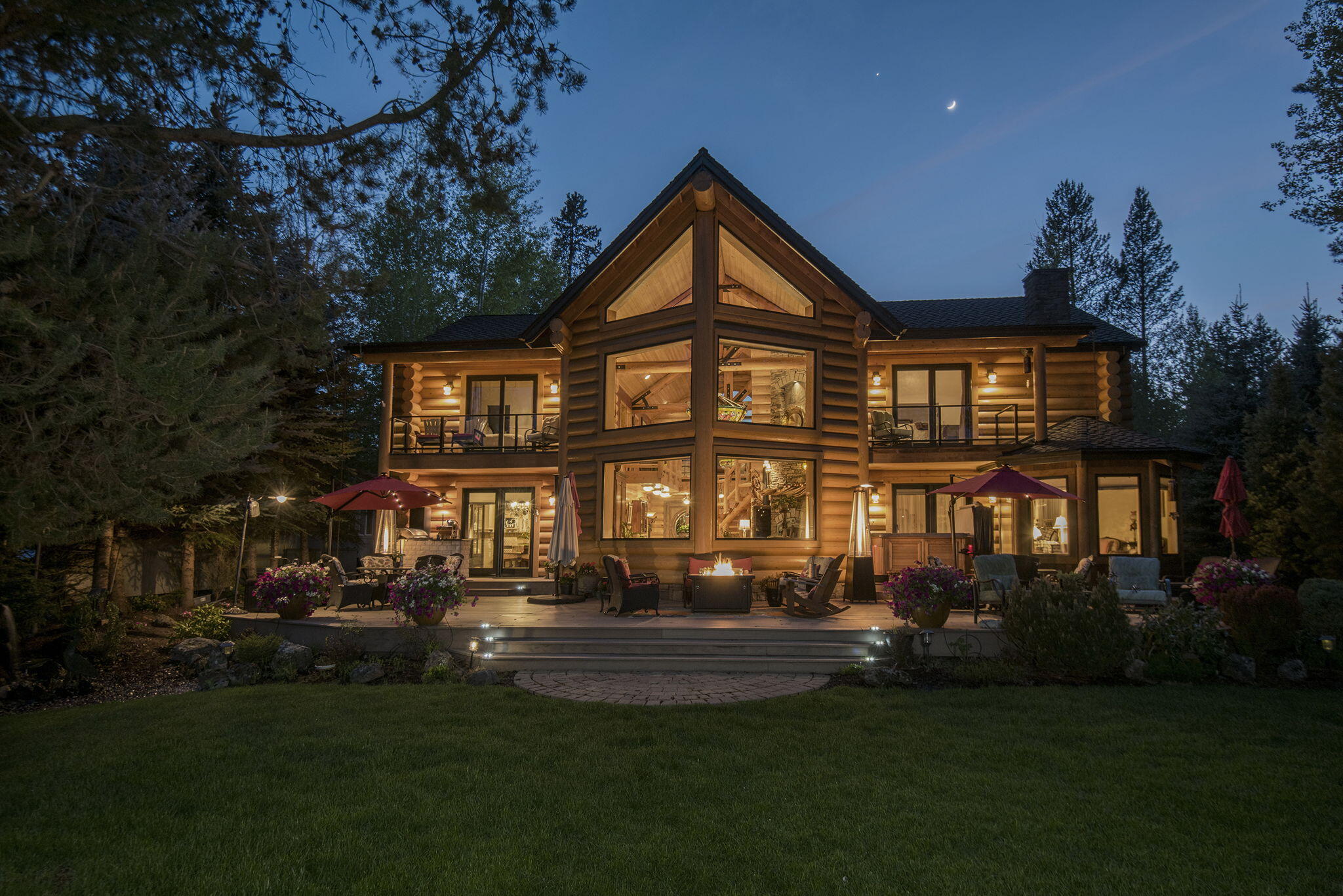 Discover the ultimate riverfront sanctuary, NOW AVAILABLE WITH 4.5% OWNER FINANCING FOR QUALIFIED BUYERS WITH 30% DOWN and 3 YR CALL!!! This custom log home spans a generous 4,200 sq. ft., boasting two primary suites, a deluxe theater room, radiant floor heating throughout, and an insulated garage with 11-ft. clearance. The living room features soaring 25-ft. ceilings, a striking stone fireplace with an 8-ft. juniper mantle, a wall of windows leads to an expansive 52-ft. riverfront deck, and an elegant Dale Tiffany chandelier. The chef's kitchen is a dream; showcasing solid maple cabinets, high-end appliances, dual-zone wine refrigerator, and not one, but three dishwashers. Experience ultimate comfort and breathtaking Deschutes River views while relaxing in the Artic Spa Hot Tub soaking in the tranquility of desirable River Meadows HOA. A walk-through video is available on Zillow under Facts & Features. Partially furnished, your river haven awaits.