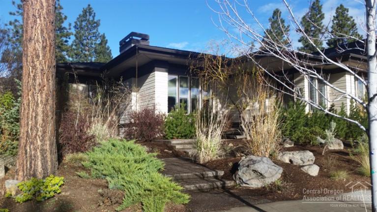 Modern single level home of outstanding craftsmanship & design with gorgeous detail in Northwest Crossing. You'll love the clean lines & open spaces. Walnut hardwood floors & built-ins throughout the home. EarthAdvantage and solar! The kitchen is showcased w/ stainless appliances & concrete counter tops. Outside you will find a fenced back yard, large deck and wonderful low-maintenance landscaping. 2-car alley entry garage with work bench & tons of storage. Big laundry/mud room. Office has built-ins, too!