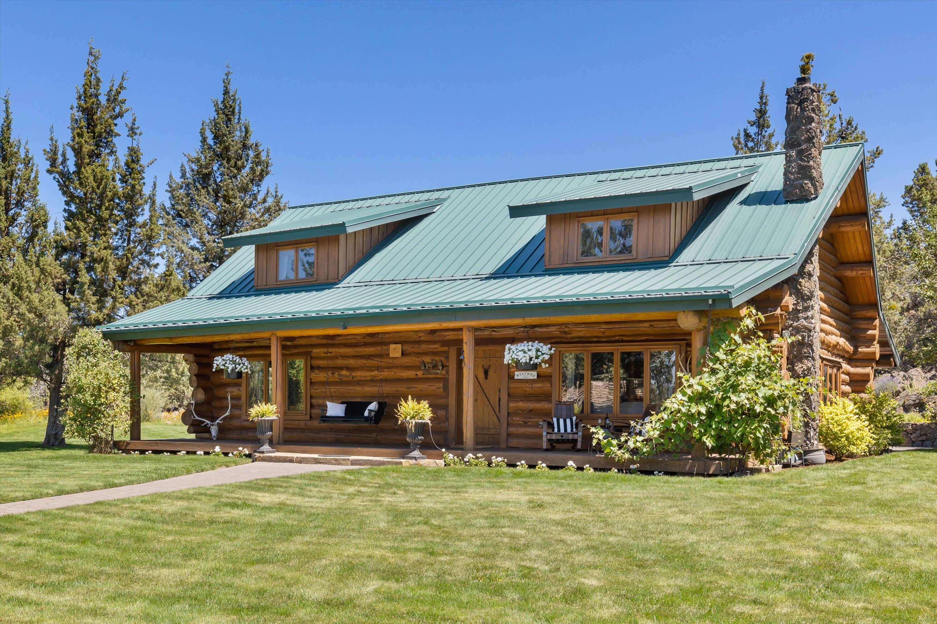 Introducing a special Bend lifestyle property that is nothing short of idyllic.  This unique hand-scribed log home tucked on a meticulously cared for Cascade view lot provides a perfect setting for those seeking privacy and tranquility with the luxury of city amenities nearby.  The property boasts a gentleman's horse set-up with corral and loafing shed, a detached garage and large storage shed.  The native natural setting is balanced with the softness of irrigated lush green lawn, a stocked pond and inviting outdoor living spaces which include a covered front porch and large private patio with a flowing water feature flanked by natural rock croppings. The home exudes character with beautifully hand-crafted vaulted ceilings, stone fireplace, wood windows, an updated kitchen and open staircase leading to the primary bedroom and lofted office space. The property is gated and has 2 acres of COI irrigation.  This is a rare gem that must be seen to appreciate the uniqueness of all it offers!