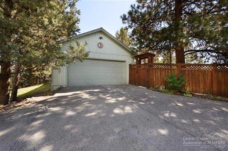 Situated up on this .28 acre lot is this single level, beautiful home. Fully fenced and very private with a tranquil outdoor water scene that makes you feel like you are in a different time and place. The home is impeccably cared for and adjoins the Larkspur trail. Lots of built-ins, light and airy with plenty of trees on the property. The large office could easily be a 3rd bedroom. This is not a drive by. Behind the gate you will be pleasantly surprised.
