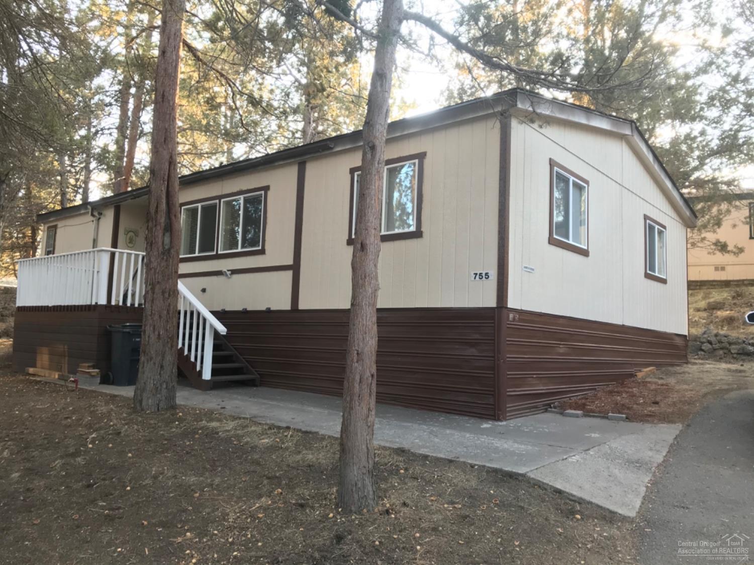 This home has been completed remodeled!!! Brand NEW roof, laminated wood flooring, sinks, toilets, cabinets, lighting & fixtures, appliances, high efficient heat pump, furnace, double pane vinyl windows and new paint inside and out. Kitchen island. Master with great separation and new wall cabinets too. Decks on both front and double deck on back. New Gravel in parking area for 3 vehicles. Storage shed included. Owner occupy only. No sublease. All occupants need park approval with credit and background checks. $730 Monthly space rent.