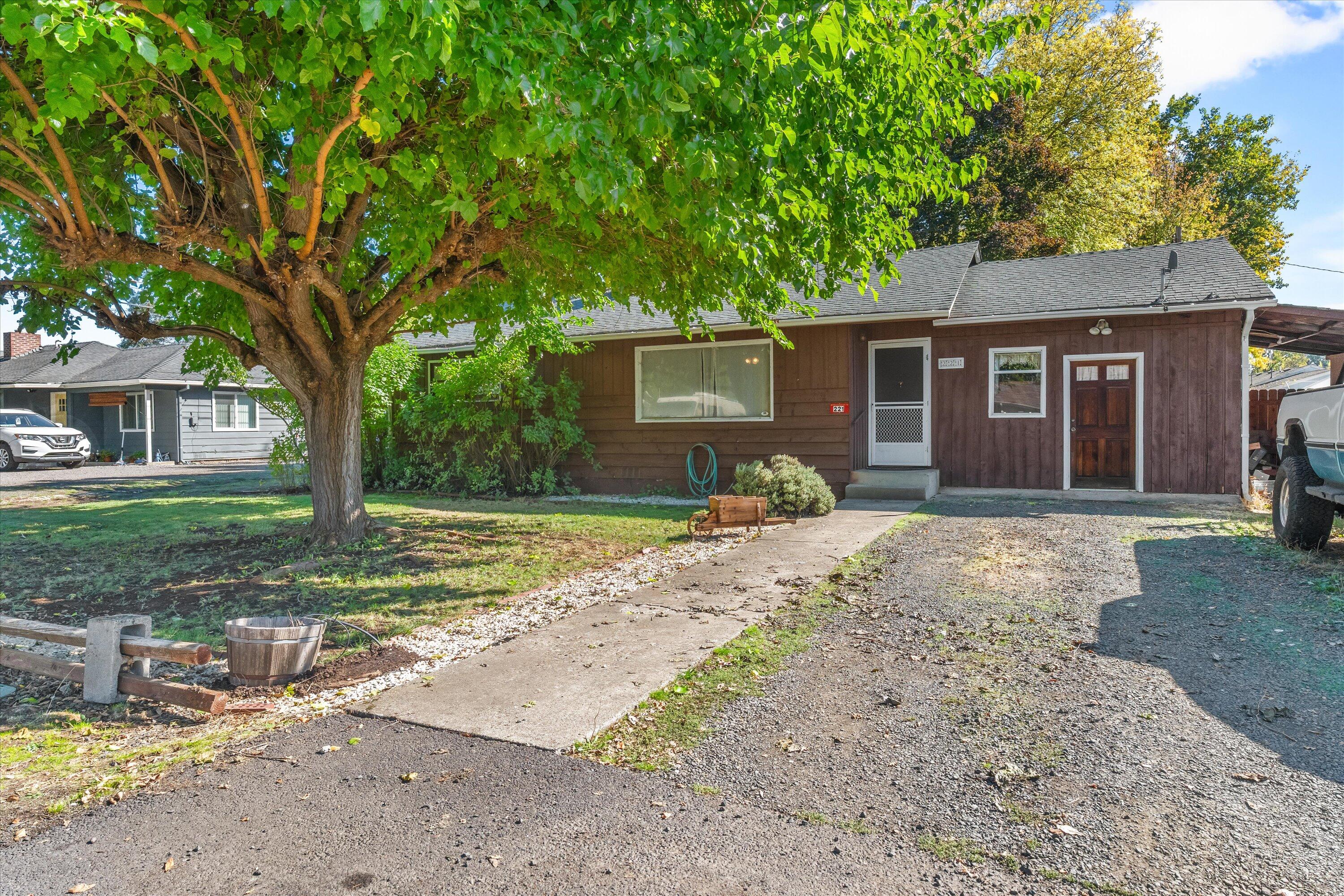 Discover comfort and opportunity in this charming 3-bedroom, 1-bath home on a spacious corner lot. Two bedrooms are located on one side of the home, with the third bedroom on the other side, and the kitchen, living room, and dining area centered in between for a functional layout. Featuring a 16x36 shop perfect for RV or boat storage, plus plenty of room for projects or hobbies. The large yard offers endless potential to add your personal touch - garden, outdoor living space, and more. Enjoy a great location close to schools, parks, and downtown Eagle Point conveniences. Seller is willing to include furniture, making this move-in ready and full of possibilities! Buyer and buyer's agent to do their own due diligence.