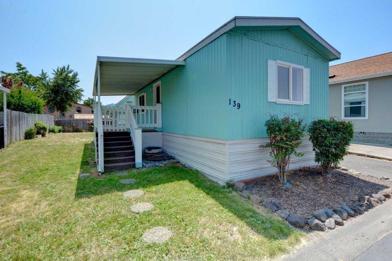This lovely single-wide home is located in the desirable Medford Estates community. This all-ages park includes a new pool and spa, a clubhouse, playground, pet park, BBQ patio, fitness room, meeting room, pool tables, and a covered mail center. Inside, the main living area features new flooring, new interior paint, vaulted ceilings, and the split floor plan offers privacy with a bedroom on each end of the home. It's conveniently located close to schools, shopping, the hospital & restaurants. Schedule a tour today!