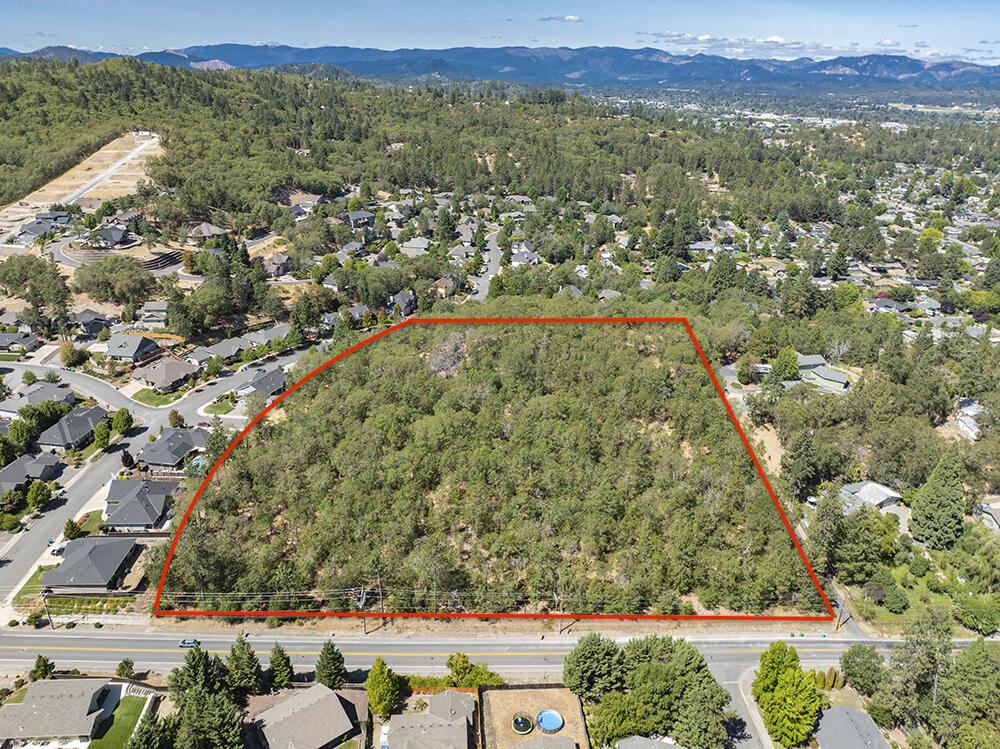 Incredible 7.66 Acres of Prime Development Property located in Grant Pass' Premier Subdivision! Located on Rosemary Lane, Phase 8 of Meadow Wood is the Last Remaining Hold-Out of Undeveloped Land in this Fantastic Subdivision. Primed and Ready for your Next Development Project, a Tentative Plan, Utility Plan, Concept Drawings and Initial Lay-out Design are in place and give you a Fantastic Road Map for turning this Amazing Property into the Next Destination for Premium New Home Builds! The Tentative Plan shows a Capability of at least 27 New Lots and likely more with New Density Allowances. Rosemary Lane and Cloverlawn Drive provide Roadway Access. A Huge Amount of work has been done here already, and the Property is Exceptionally Priced, taking into consideration the Actual Expected Development Costs to get the Lots 'Builder-ready'. There are VERY few Developable Parcels to even be found in this part of Town. If you have been looking to Go Big or Go Home, this is the one for you!