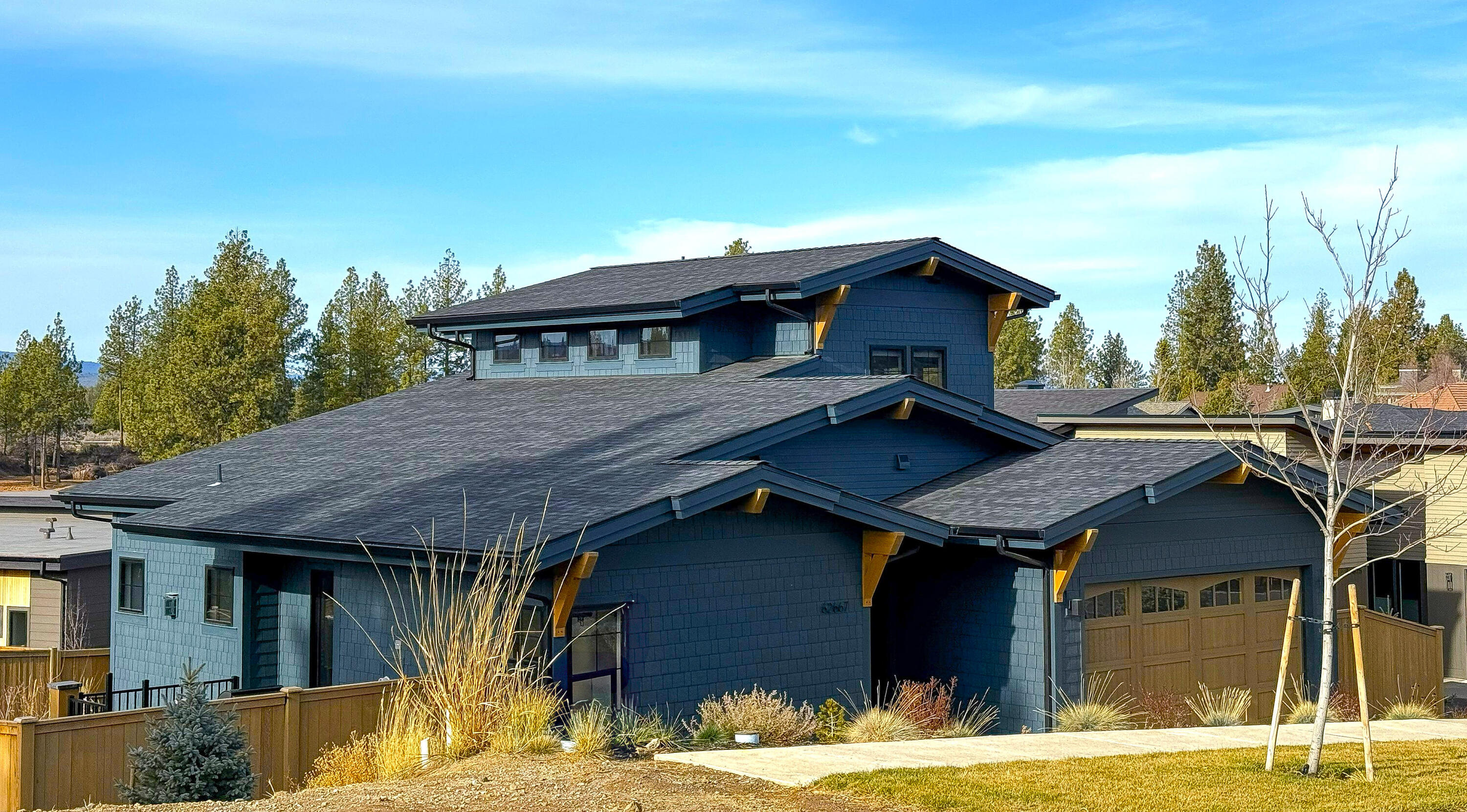 Refined, handcrafted, and nearly new with Cascade Mountain views from both levels. This Shevlin West home is adorned with gorgeous light fixtures, built-in cabinetry, Viking appliances, and premium finishes like solid core 8' doors throughout, wide plank engineered wood flooring, built-in BBQ, and an exceptional window package. In addition to the great room the main level also holds a stylish powder room, laundry room with built-ins, & polished master suite with radiant bathroom floors and curated tile & fixtures. From this elevated setting you can see the alpenglow off the Cascades and watch weather roll-in and over the mountain range. The covered side and back porch are oriented to take advantage of the warm, SW exposure. Room for everyone in the fenced backyard. Unbeatable location with Shevlin Park and numerous trails right out your back door including the new Manzanita Park across the street. The entire driveway is heated!