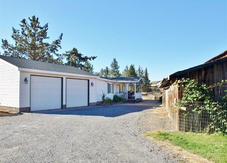 Imagine having room to roam, yet close to town. Well maintained property on .92 acre lot just off Cooley Rd. An open floor plan w/neutral colors. Good bedroom separation. The large master has a walk in closet. The larger utility room has ample shelves w/clothes racks & a breezeway that goes into the attached garage & out to the back deck. Enjoy an old historic barn, covered RV carport, vegetable garden w/sprinklers & drip system, greenhouse, deck & covered front deck. A perfect place to call home!!
