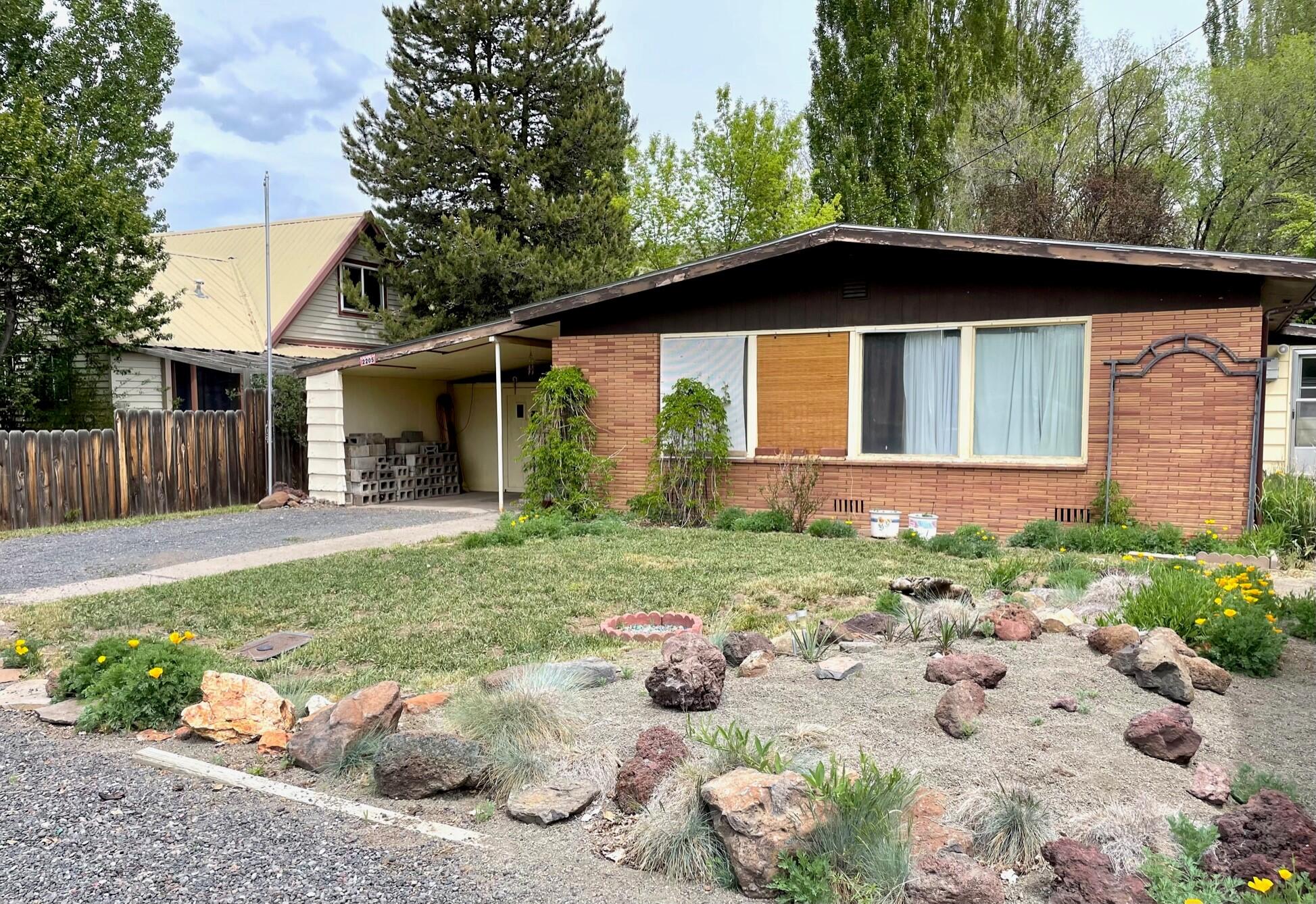Come check out this well cared for 2 bedroom, 1 bathroom on a super spacious lot. Home has outbuildings including two 12' x 12' sheds with power, and 13' x 10' workshop with power and attached covered storage. There is also a large carport. New roof 2020. Most appliances are newer. This home is being sold as is.
