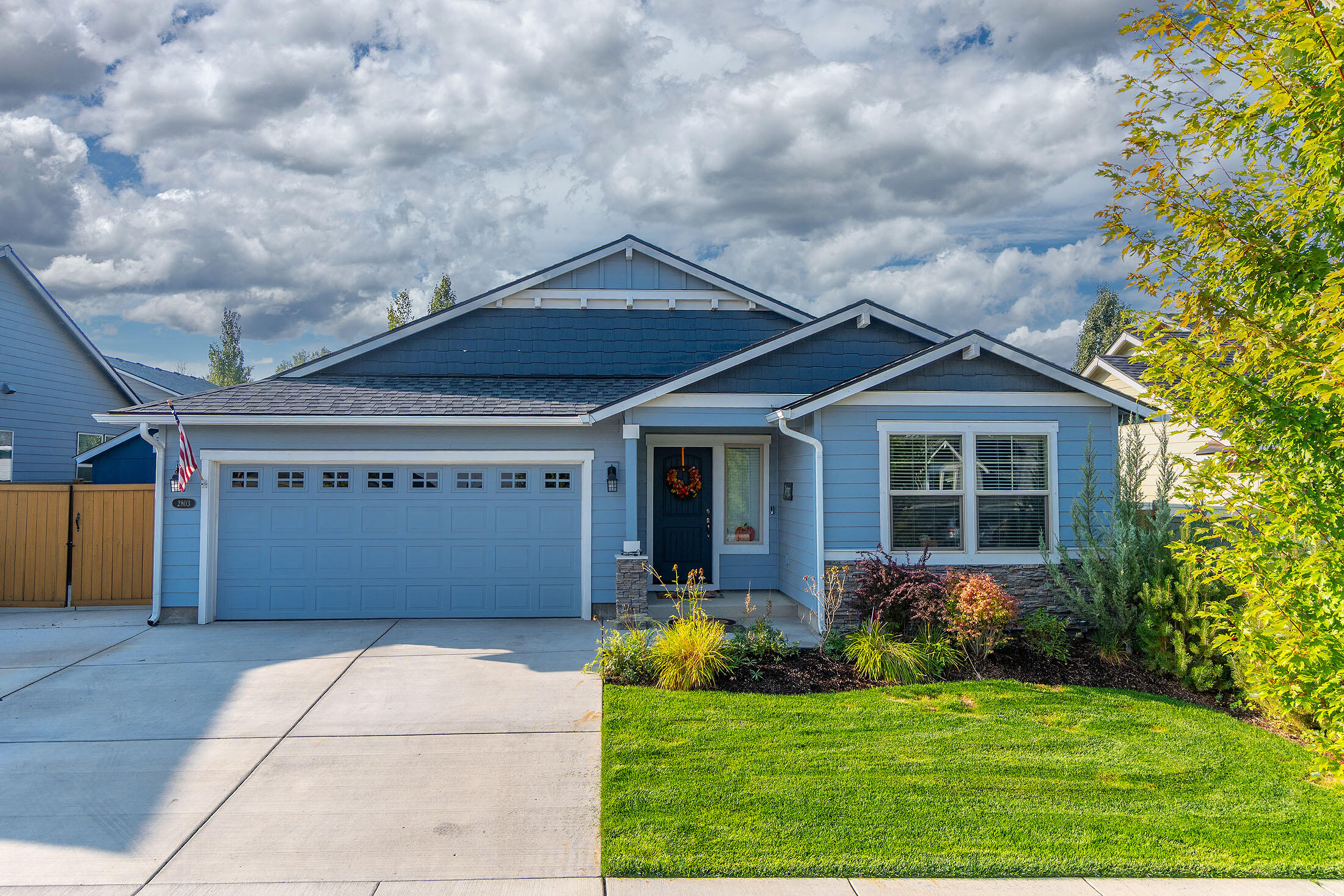 Your dream awaits! Enjoy this gem of a main-level home, w/ primary & additional on suite, built in 2017 in desirable Eaglenest! Craftsman open-concept floor plan highlights a spacious chef's kitchen equipped w/ stainless steel appliances, dual ovens, and a luxurious quartz island—perfect for everyday cooking or entertaining guests. Vaulted ceilings in the living room create an airy, inviting space filled with natural light. Large primary suite offers a spa-like retreat w/ large soaking tub, full tile shower, and generous walk-in closet. Step outside to enjoy the covered/screened expansive stamped patio and private backyard, ideal for outdoor gatherings. The oversized garage provides ample storage, complemented by dedicated fenced-in RV parking. Located in the heart of neighborhood, the home directly accesses  parks, schools (Mtn. View),  St. Charles, & many shops.  With its thoughtful design and prime location, this home truly has it all; make it yours today!