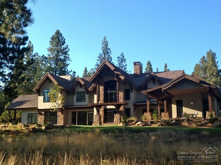Celebrating the Central Oregon lifestyle, the dramatic lodge-style home emphasizes casual luxurious living amidst Ponderosas on 10 acres in The Highlands, a prestigious gated community 2 miles from downtown Bend. South facing windows bring in sunshine & Mt Bachelor Views. Stucco & stone exterior, radiant heated travertine floors and extensive cherry interior. Vaulted wood ceilings, granite counters & premium appliances. Incredible location bordering Nat'l Forest & Phil's Trailhead & close to schools.
