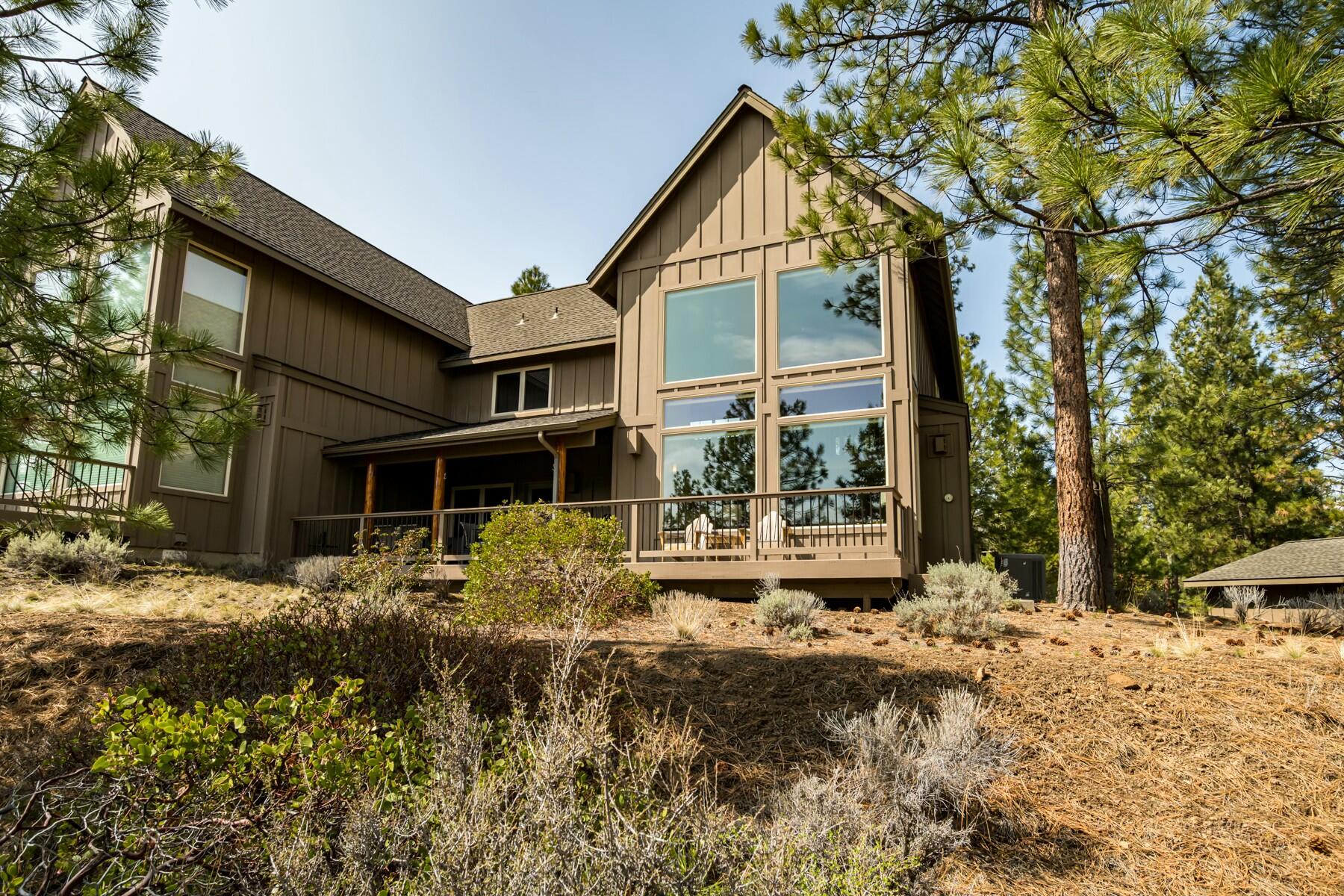 This meticulously maintained townhouse in the River Wild community offers stunning canyon and peek-a-boo river views from the patio. This home features a spacious open floor plan with soaring ceilings and abundant natural light. The main level includes a gourmet kitchen with granite countertops, Alderwood cabinets, and newer appliances, plus a living room with custom electric blinds, and a gas fireplace. The primary suite on the main level provides a private door to the deck/patio, walk-in closets, and an ensuite with a walk-in shower and a soaking tub. Upstairs, a versatile loft serves as a guest space or office with views to the living room and canyon. The home offers excellent guest separation with the second bedroom upstairs, a laundry room with built-in storage, and newer floors and carpet. The 2-car detached garage adds convenience and storage. All furniture is included in the sale, making this a turnkey property. Don't miss the chance to own this exceptional property!