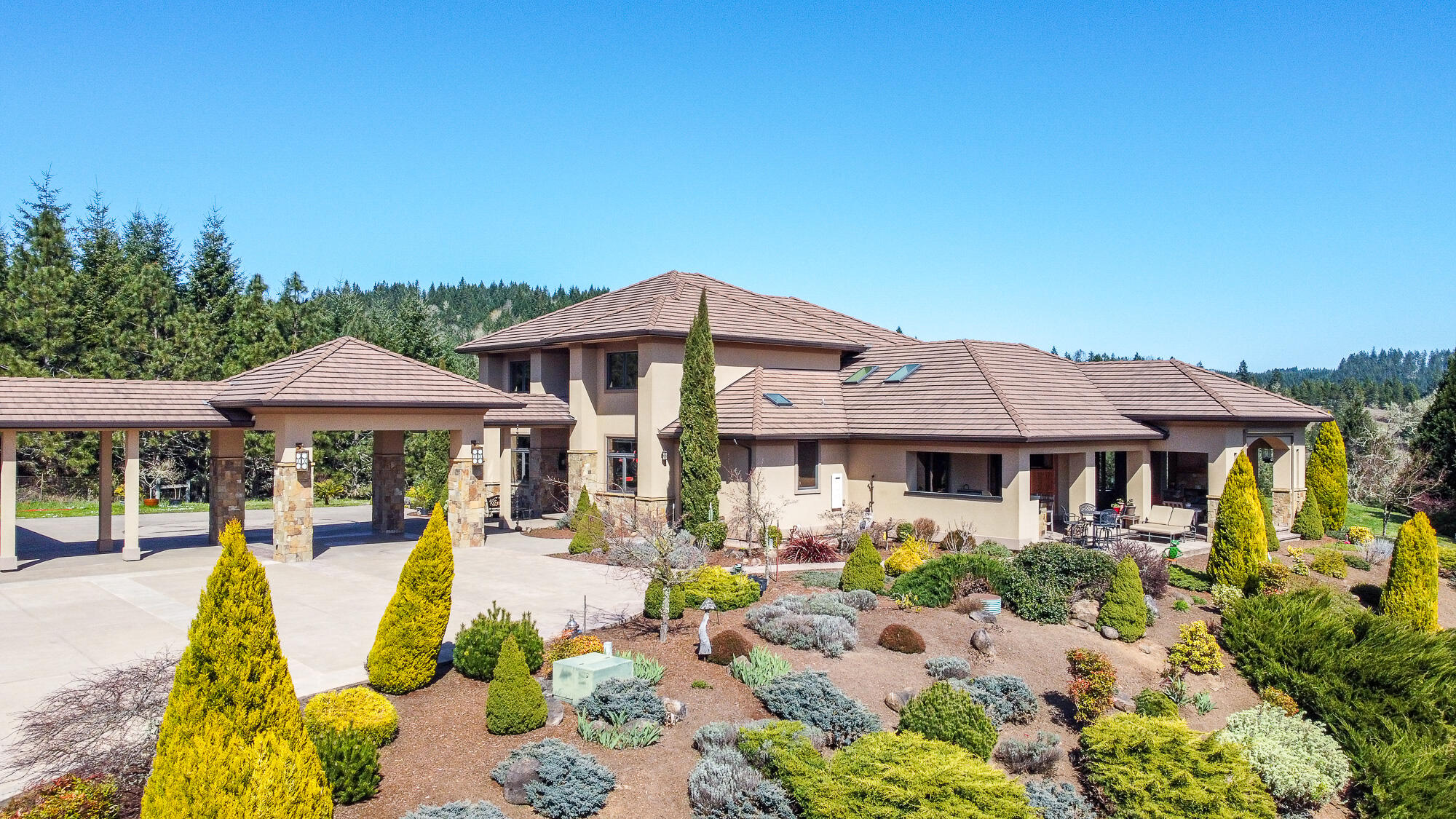One of a kind, contemporary, Mediterranean style home in the heart of Wine Country. Approx 24 acres of rural secluded estate property, with extensive views to neighboring wineries. This home was on the 2011 Tour of Homes. Features 4,650 sq ft of living space with an addtl. 1,450 of covered outdoor area.  5 bedrooms, 3.5 bath. .  Concrete tile roofing with stucco exterior and natural stone accents.  Energy efficient design with natural ventilation and lighting.  Eco-Friendly home with Super Good Cents standards, ENERGY STAR appliances. Tankless water heaters, dual efficiency heat pumps with zoned/control/filtration and a rain water harvesting system for landscaping and organic gardening.  Gourmet kitchen with 2 islands, Sapale hardwood cabinets, granite countertops, finest appliances (WOLF and SUBZERO) Outdoor living w/fireplace, kitchen & entertaining areas.  Stamped/stained concrete patios & driveway.   3 car garage with office and bathroom & covered porta cochere.  Lg metal building