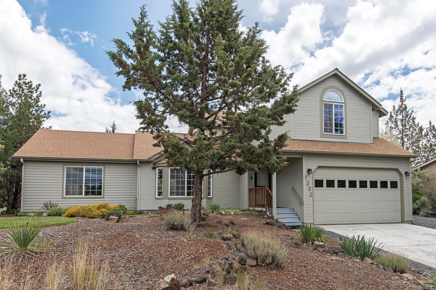 All you want & more! Classy, eclectic 4 bed/3.5 bath home on huge, private lot in desirable Providence. Lots of light in the dramatically vaulted living/dining, & bay window w/nice mountain views! 2 mstr. suites - 1 up, 1 down. Downstairs suite is handicapped accessible w/an exterior door, giving it more possibilities as a home office or other use. Easy care landscaping in front w/native perennial rock garden. Back yard is very private w/patio, grassy & natural areas, & shed. Near shopping, med, park, etc.