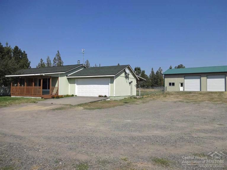 Ranch-style home on 4.2 acres on Bend's East side just minutes from shopping and medical facilities. Pastoral view from the living room. Some Cascade Mtn. views from the porch. Spacious kitchen/dining area with Corian countertops. 2 acres of COI irrigation, fenced pastures. The property also has a 1728 sq. ft. shop with big doors, a chicken coop, plus a single-car garage/storage building. This is a great property for 4-H or to just live in a very peaceful setting.