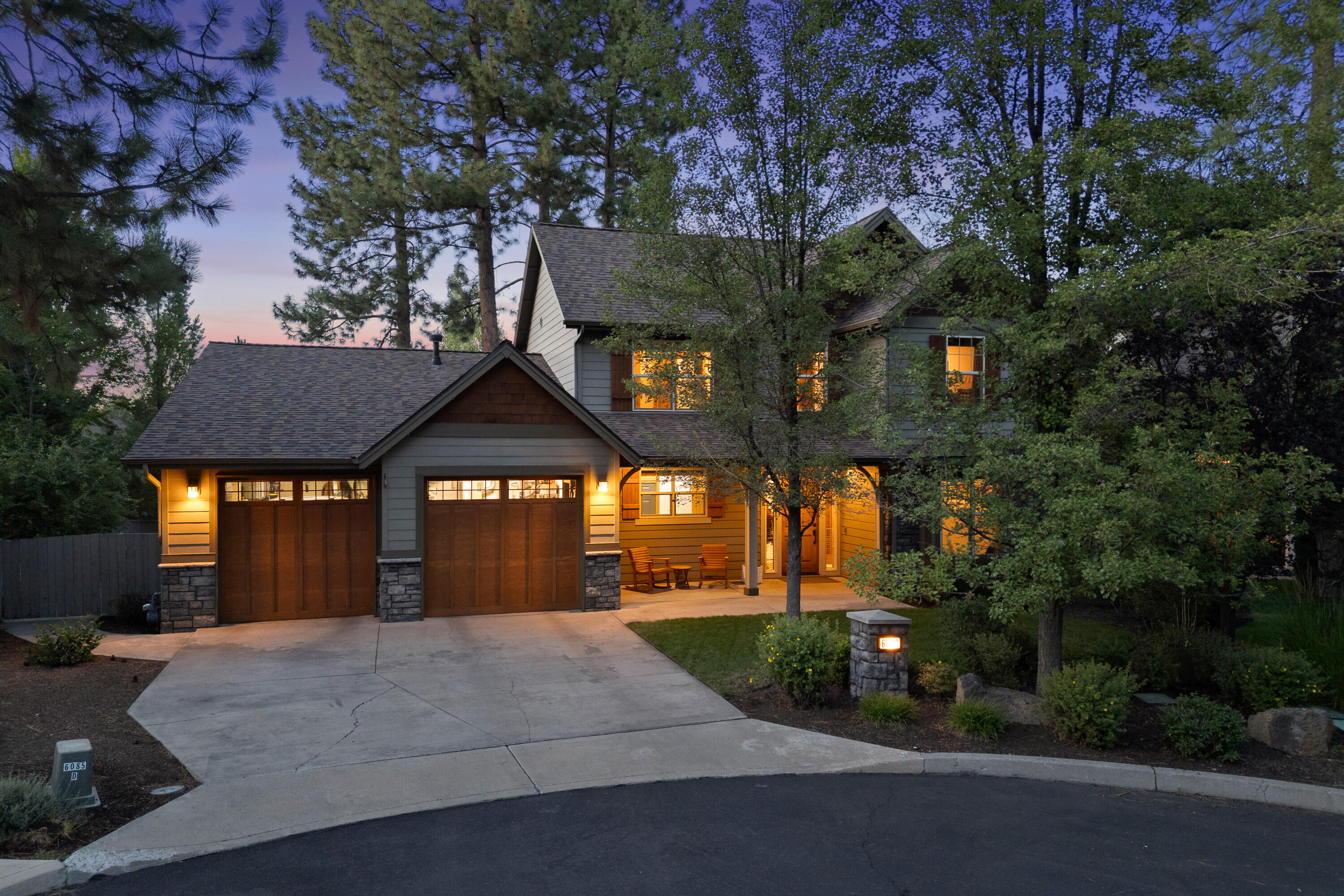 Tucked in a quiet RiverRim cul-de-sac on nearly 1/4 acre, this stunning mountain modern home is designed for comfort, livability, and connection to nature. The main level features a private primary suite, an open layout, rich hickory cabinetry and wood flooring, and windows that bathe the living space with natural light. A versatile office just off the entry adds work-from-home flexibility. The newly updated chef's kitchen shines with natural stone counters, a matching backsplash, and new high-end appliances. Upstairs, find three bedrooms, a guest bath, and loft space. Step into your own outdoor oasis - a beautifully landscaped backyard framed by towering pines, featuring multi-level decking and a natural gas hookup. Additional highlights include new interior paint, updated baths, a 3-car garage, and a recently replaced roof. Minutes to the Deschutes River, trails and just 3 miles from the Old Mill District, this home blends natural beauty with a prime location.