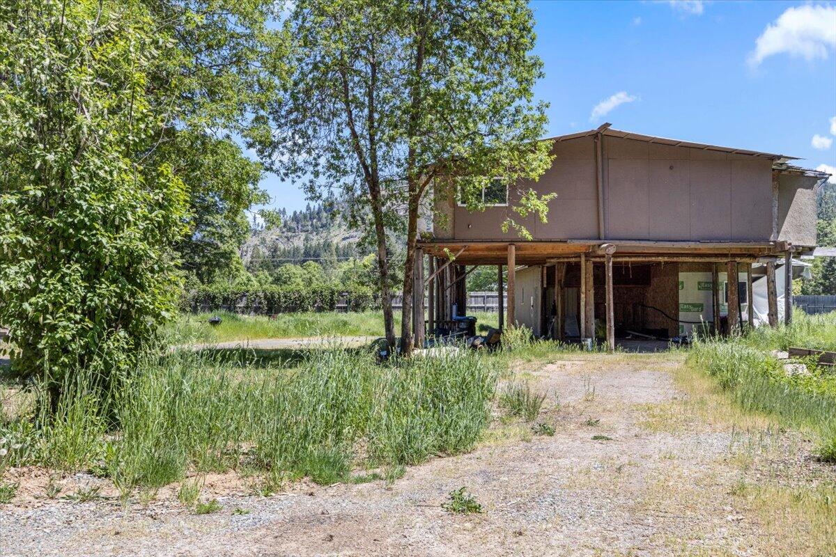 *Tenant Occupied do not enter property without agent! Looking for a private retreat close to the lake? This home is 2 minutes from Lake Selmac. It's fully fenced and offers great views of Greyback mountain. The neighboring BLM land is perfect for horseback riding or trail riding! Selma is located only 1 hour away from the Oregon coast and 10 minutes away from the beautiful Illinois River! Emergency services are close to property.  This property offers excellent gardening opportunity with full sun and 12 water spickets throughout the property. It is part of the spring-loaded Thompson Creek draining system with alluvial soil. The well water tastes great! The property has a wraparound gravel driveway with a spot for a pond or pool. There is a small cabin that could be turned into a studio. The home is a diamond in the rough but great way to add your finishing touches! Sold As-is. Owner will carry with large down. *Tenant Occupied do not enter property without agent!