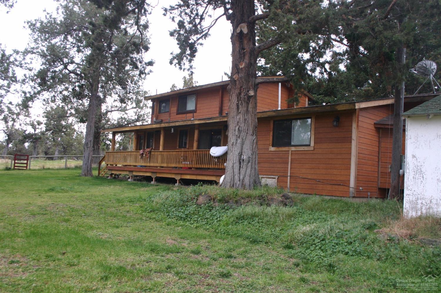 Unique 80 acre parcel in NE Bend with incredible potential featuring two residences, multiple barns & shops. 2 story main residence has open kitchen, cedar interior/exterior, covered porches, garden & more. 2nd home (1,485 sq ft) 2 bedroom was completely remodeled & re-plumbed. Huge outdoor show arena for horses. 19,000 feet of buried irrigation, 3 ponds & 2 pivots. Several great building sites. Has been used for cannabis grow.
