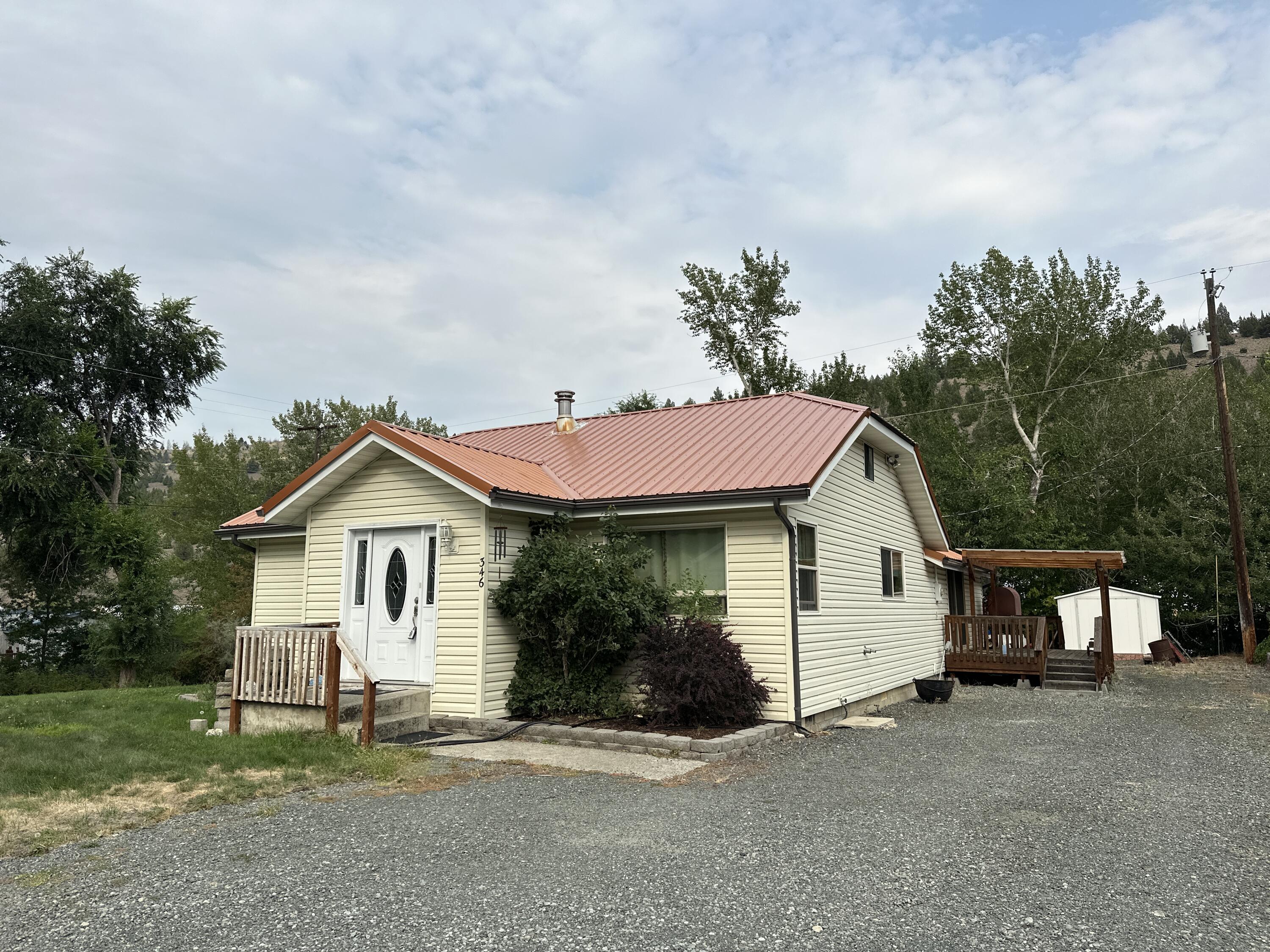 Pride of Ownership! Bordering Canyon Creek, this charming 3-bedroom, 2-bath home boasts 1,580 square feet of living space. Built in 1981, the property features a 0.21-acre lot with a beautiful yard, a covered deck, and a storage shed. It includes both a living room and a family room, along with a spacious kitchen filled with ample cabinets. The home is equipped with three heating sources: an electric furnace, a propane heater, and a laser oil stove. This well-maintained residence is move-in ready, both inside and out. New kitchen appliances included along with washer and dryer. New Microwave & Range ordered and will be installed