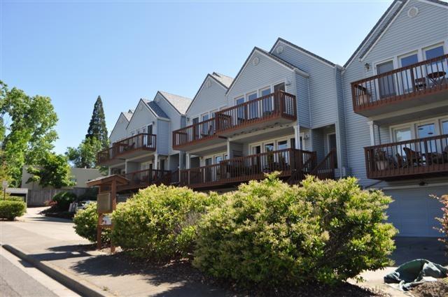 Great location a few blocks from the Plaza in downtown Ashland. The actual building is three stories with the ground level a double garage, work space area and large room behind great for storage, crafts, work bench, exercise room etc. Huge master suite with private balcony gazing to the mountains, large closets, spa like private bath. The second bedroom also has mountain views and the third bedroom/office is open to staircase (easily enclosed if one wants) The main level has large livingroom, with private balcony enjoying mountain views from inside and out. Semiformal dining open to living and nice kitchen with large window and access to deck and small fenced back yard. 1/2 bath off kitchen with laundry facilities. One of five units. This is not part of Glenn Vista and does not have the fees or use of pool etc.