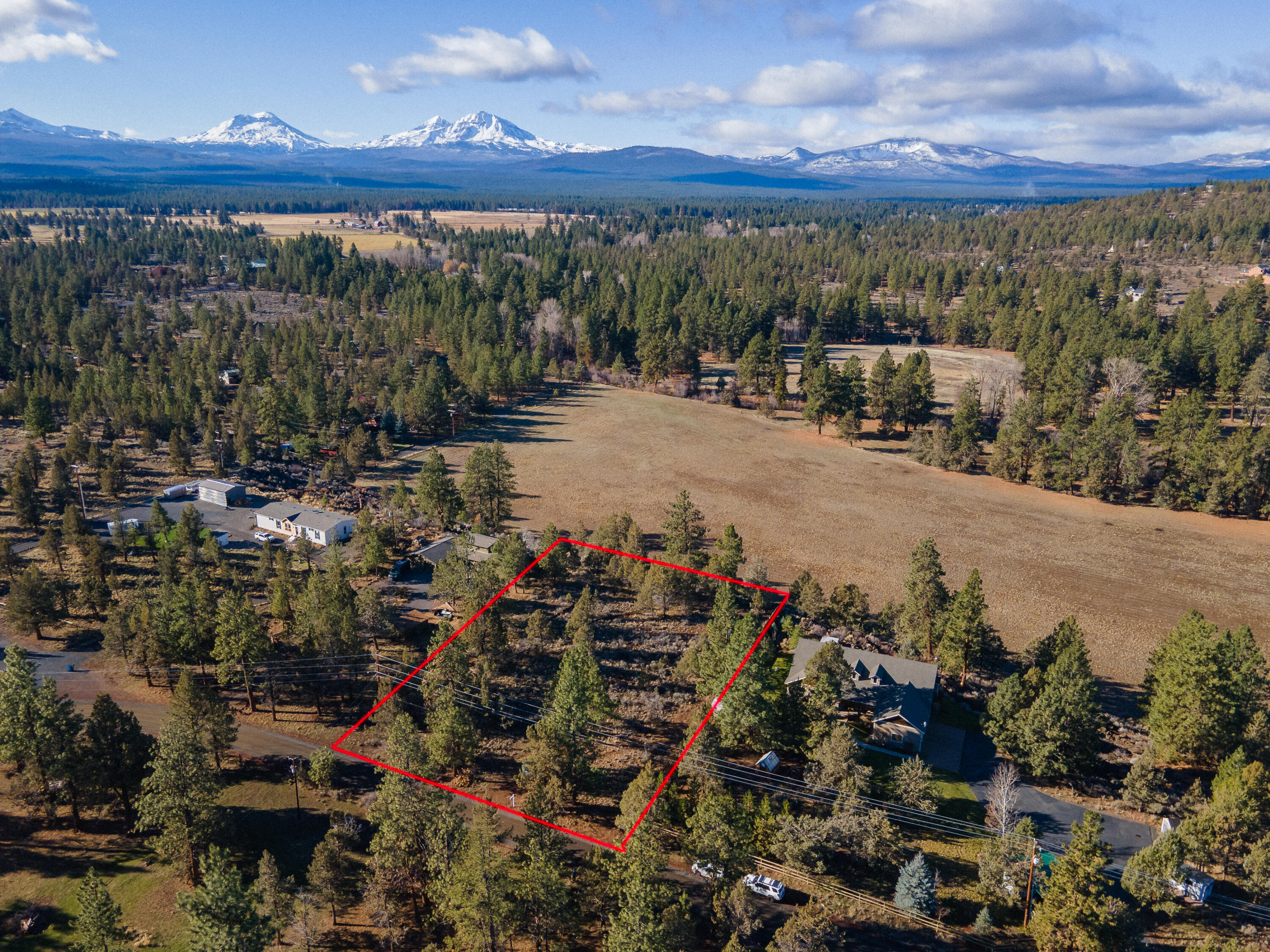 Perfect homesite with great mountain views and extremely close proximity to downtown Sisters. This 1 acre parcel is nice and flat with Juniper and Ponderosa Pines throughout the lot and is ready for you to build your dream home! Experience rural living without all the work on this small acreage just outside of town, sitting atop a bluff with no one behind you. Needs septic and well.