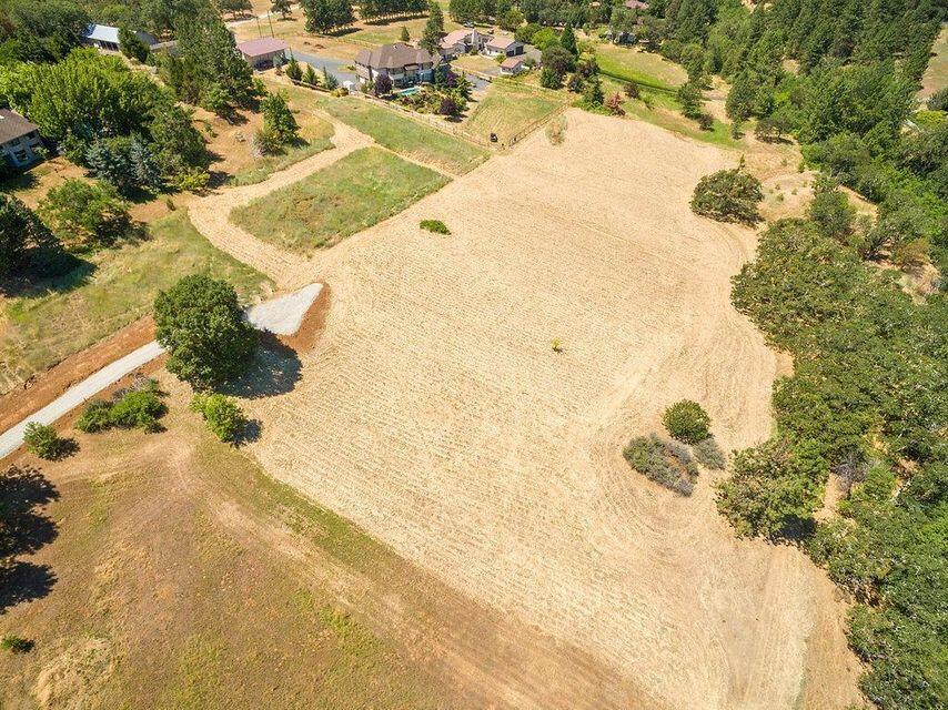 Gorgeous 5+ acre parcel  in the Jacksonville-Livingston Road area of the West Hills. This very exceptional 5+ acre buildable parcel, features spectacular views, 2 wells, septic approval, RR-5 rural residential zoning and a small fort-like structure near the creek. Located in an area in which you cannot overbuild for. Parcel topography varies, with knoll to rolling, gently sloping, a small rock outcropping overlooking a recessed seasonal creek that is a boundary for one side of the parcel. Come envision your dream home here. Shown by appointment only!