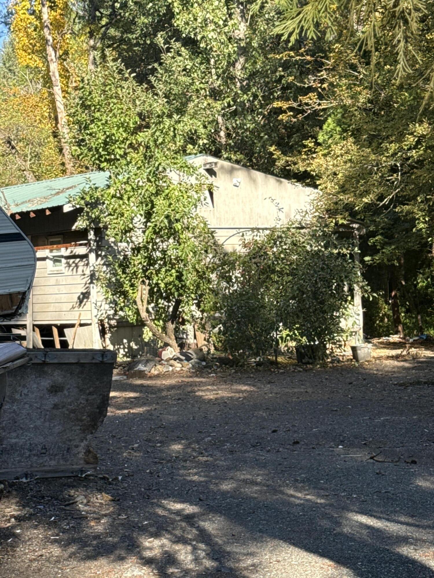 .70 acre lot with functioning well and septic system. A creek borders the back of the property. providing a natural setting. Existing structures and current items will remain and are included in the sale. Value is in the land.

Property is being sold as is. Buyer to perform all due diligence regarding condition, utilities and intended use.