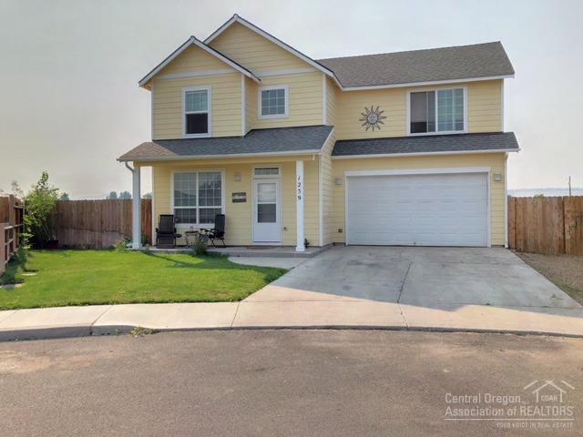 Beautiful home that backs up to open wetlands and features amazing views. The private backyard is fenced for kids or dogs with a large patio and fire pit. The home features 9 ft ceilings with vault, gas furnace, fireplace and central A/C. Upstairs the laundry room is conveniently next to master suite which features his and her sinks and a walk-in closet. Ceramic tiled gas fireplace in the living room with an open living area downstairs, with a 1/2 bath.