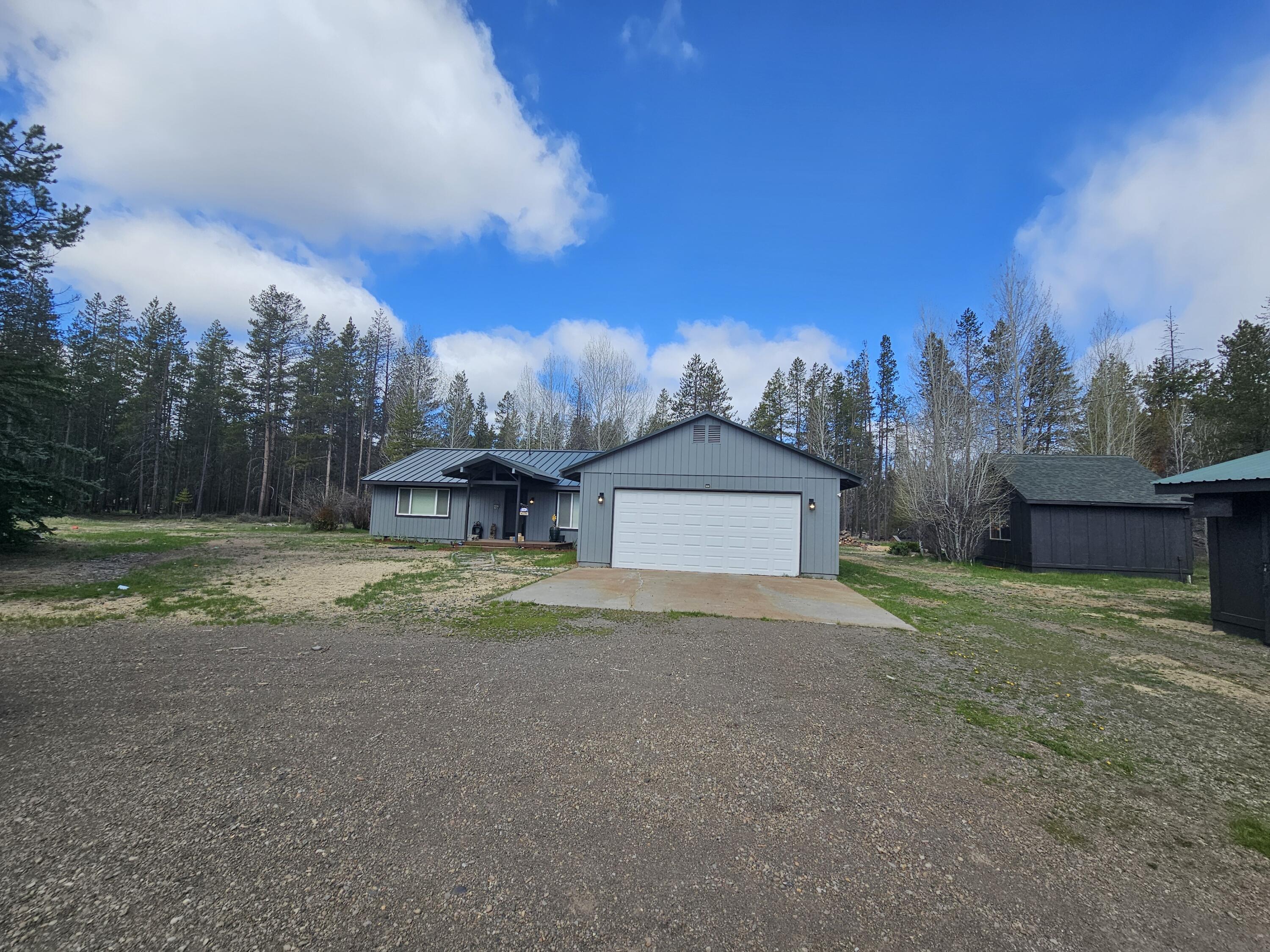 Beautiful cozy Farm Style house on 4.61 acres is ready to become a mini ranch...develop your dream shop! Located in a rural area just minutes to town, come enjoy the privacy of having room to roam! This 3 bedroom, 2 bath home has recently been renovated from the studs in by a local Bend contractor in 2023 including but not limited to a new metal roof! Completely fenced, detached small shop with electricity behind the tractor/lawnmower area, also a chicken coop, a new well pump with water filtrations, and much more!  Acreage is getting hard to find...come preview this home soon!